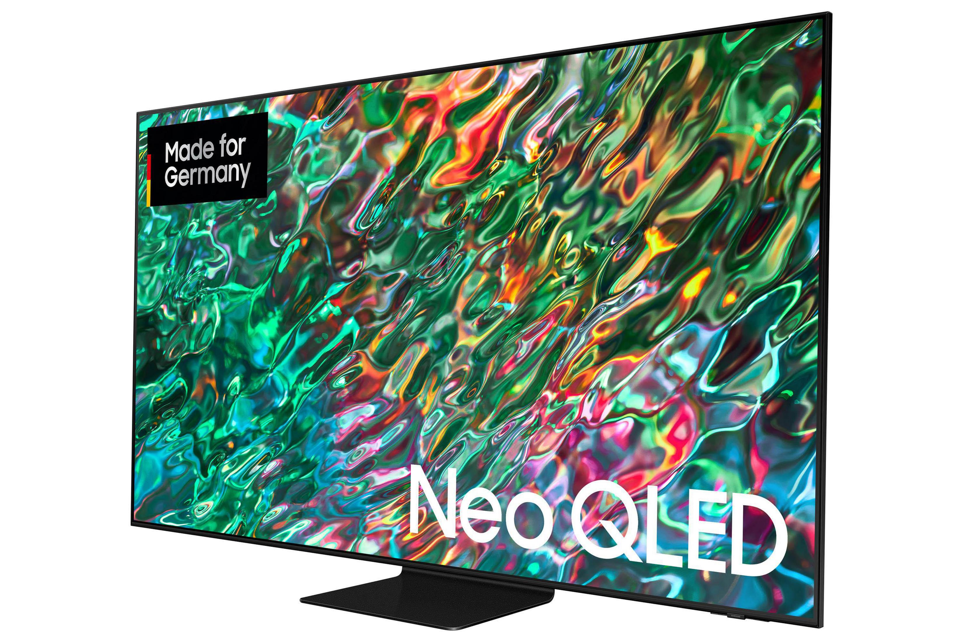 Duży telewizor Samsung Neo QLED, z kolorowymi abstrakcyjnymi wzorami na ekranie.