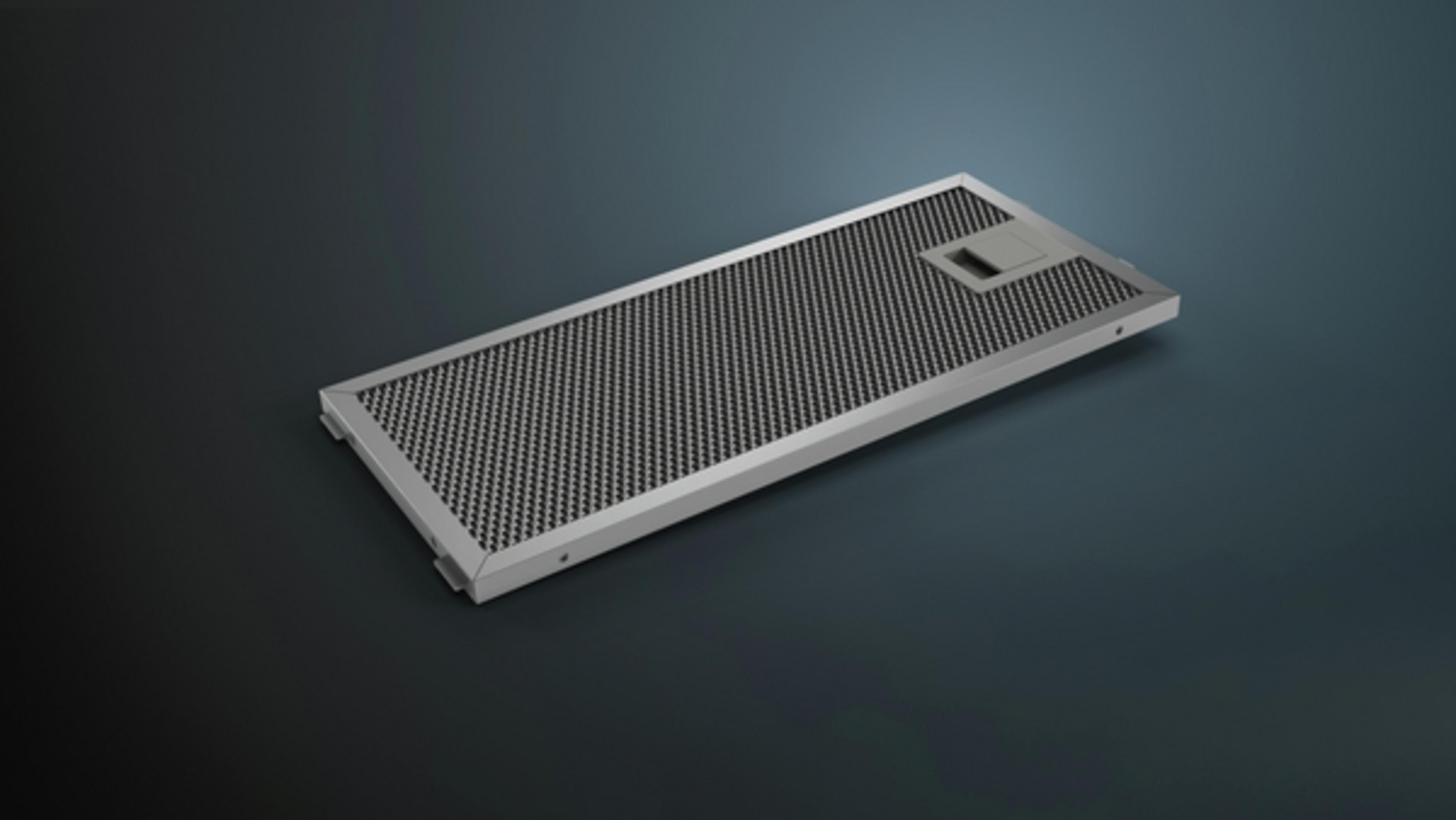 Silver rectangular metal filter on a dark background.