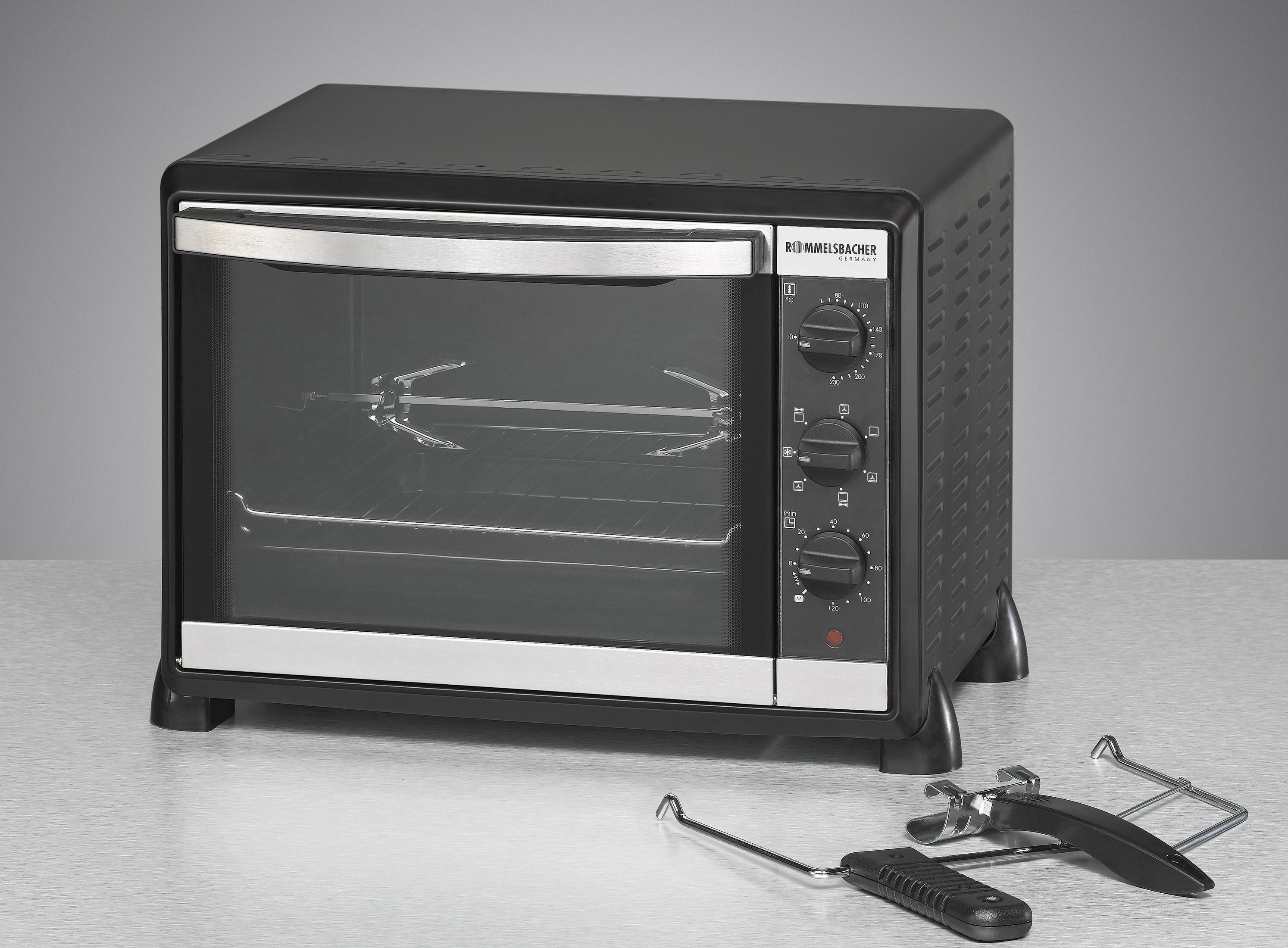 Forno da banco nero con funzione girarrosto. Accenti argentati e accessori davanti.