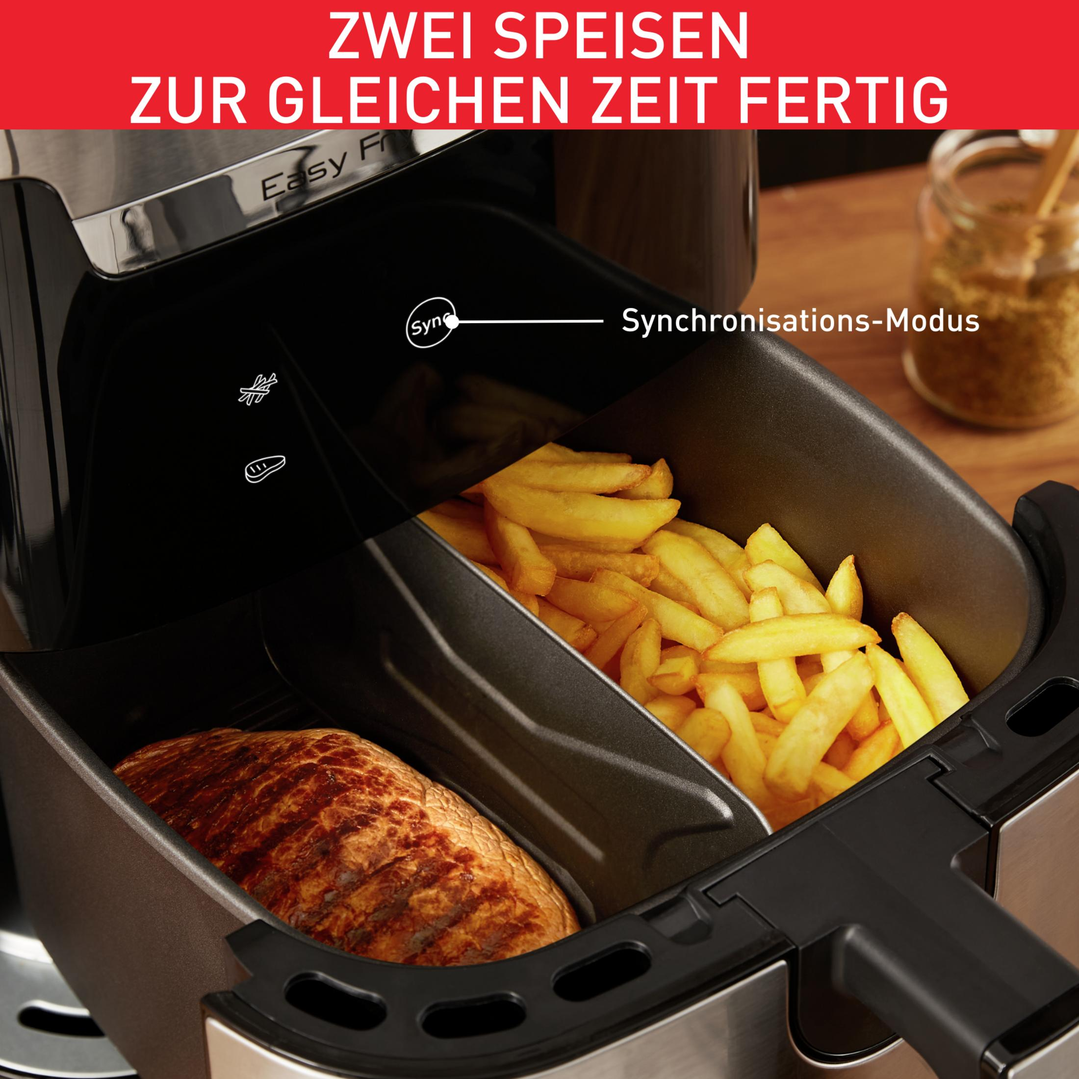 Friggitrice ad aria con due scomparti: uno con patatine fritte, uno con bistecca. Testo: Due pasti alla volta.