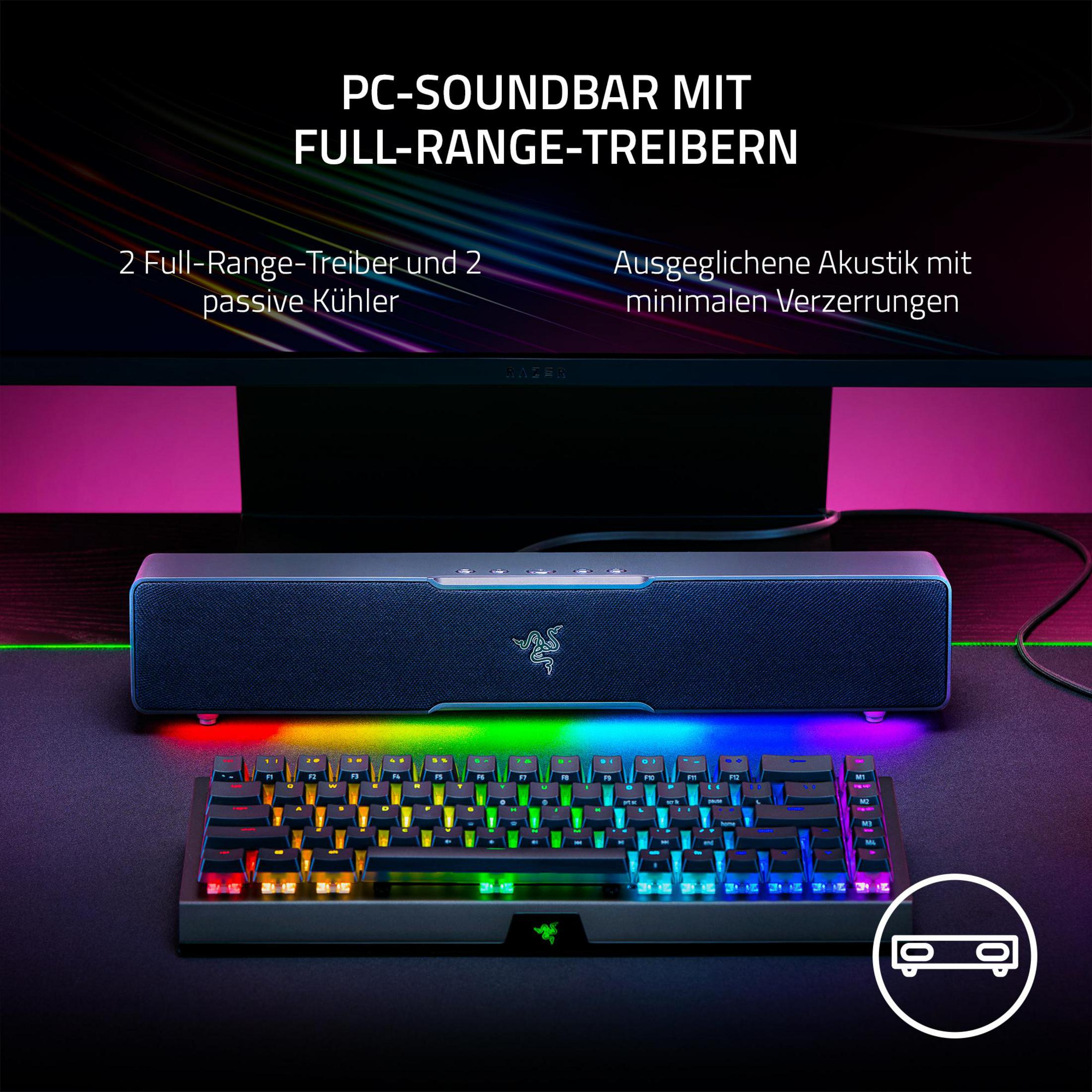 Soundbar PC z oświetleniem RGB, klawiatura poniżej i logo Razer.