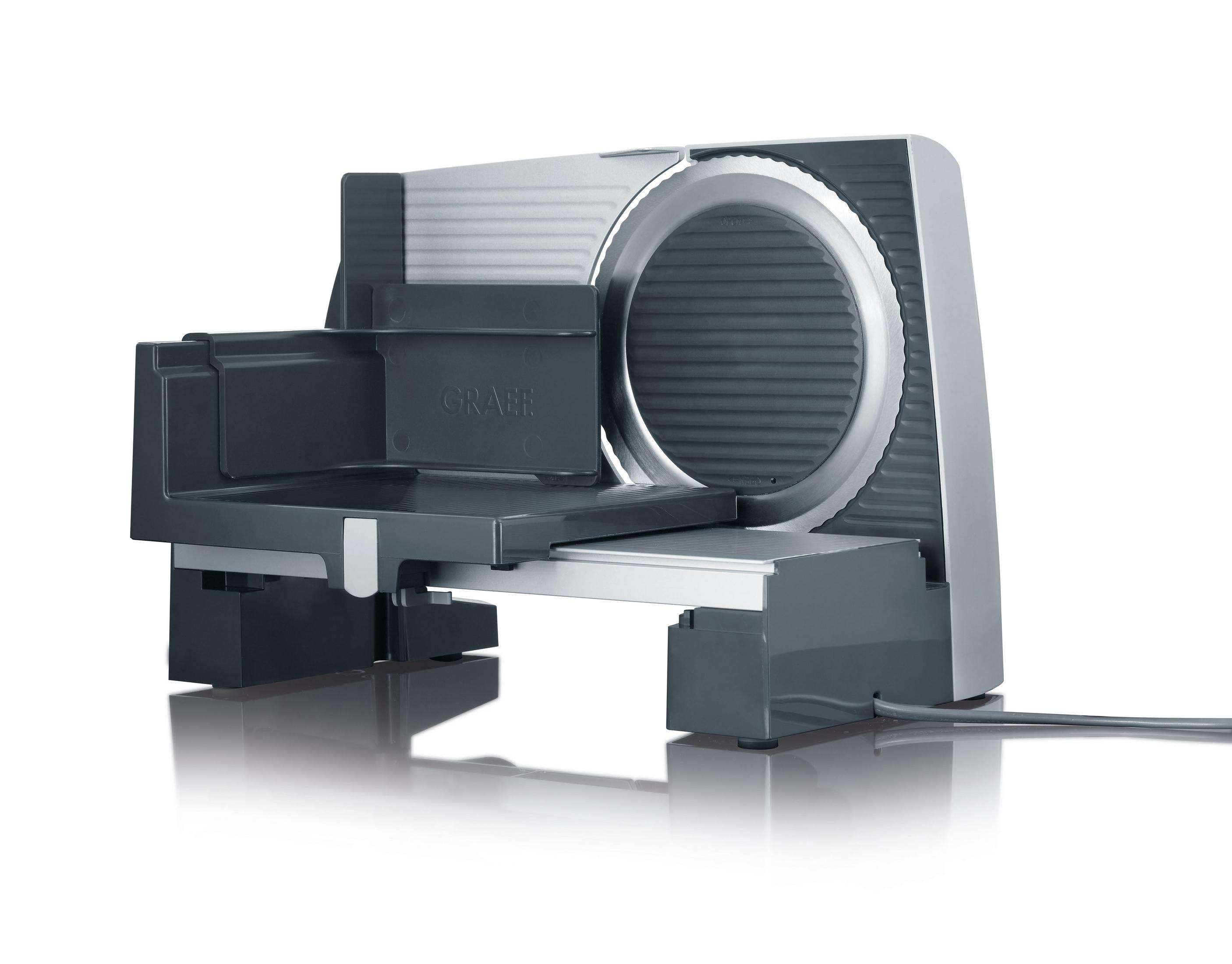 Szara i srebrna krajalnica do żywności na białej powierzchni.