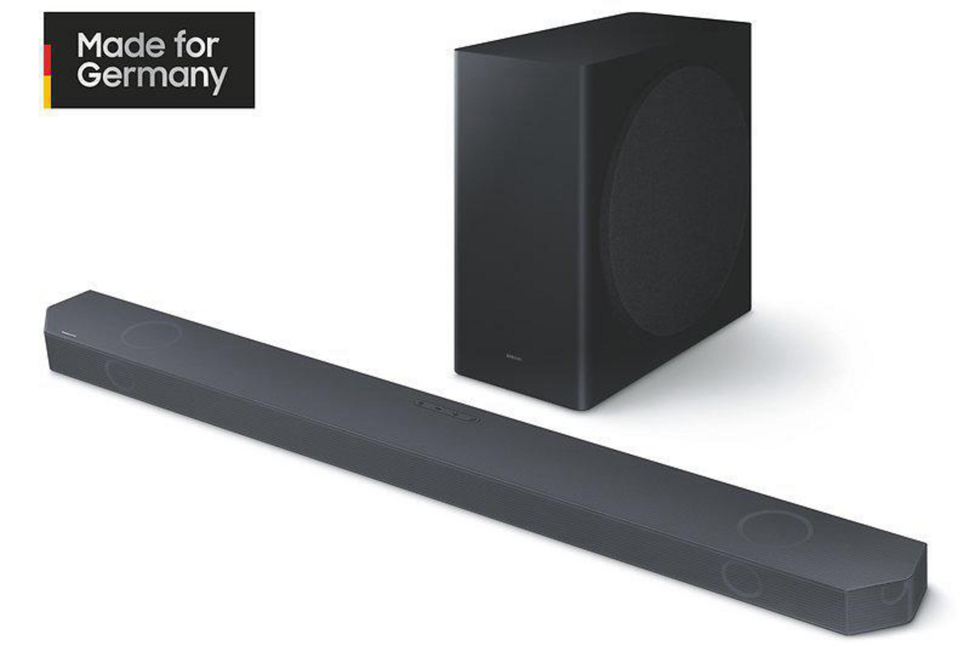 Schwarze Soundbar und Subwoofer, mit Made for Germany-Etikett, vor weißem Hintergrund.