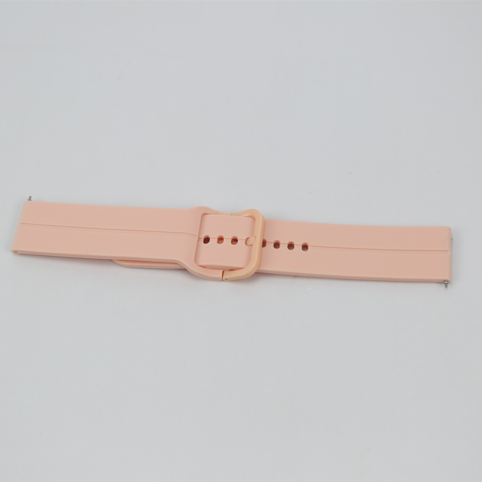 Rosa Uhrenarmband mit Schnalle. Einfacher, sauberer Hintergrund.