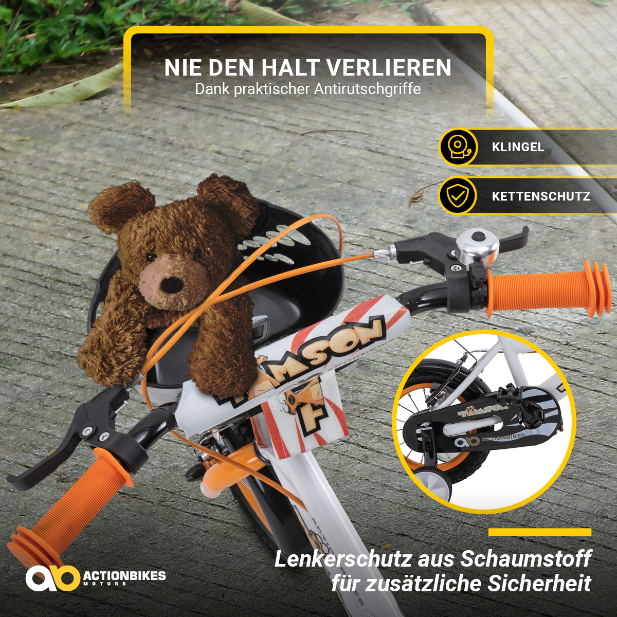 Der Lenker eines Kinderfahrrads mit Teddybär, orangefarbenen Griffen und Sicherheitsmerkmalen.