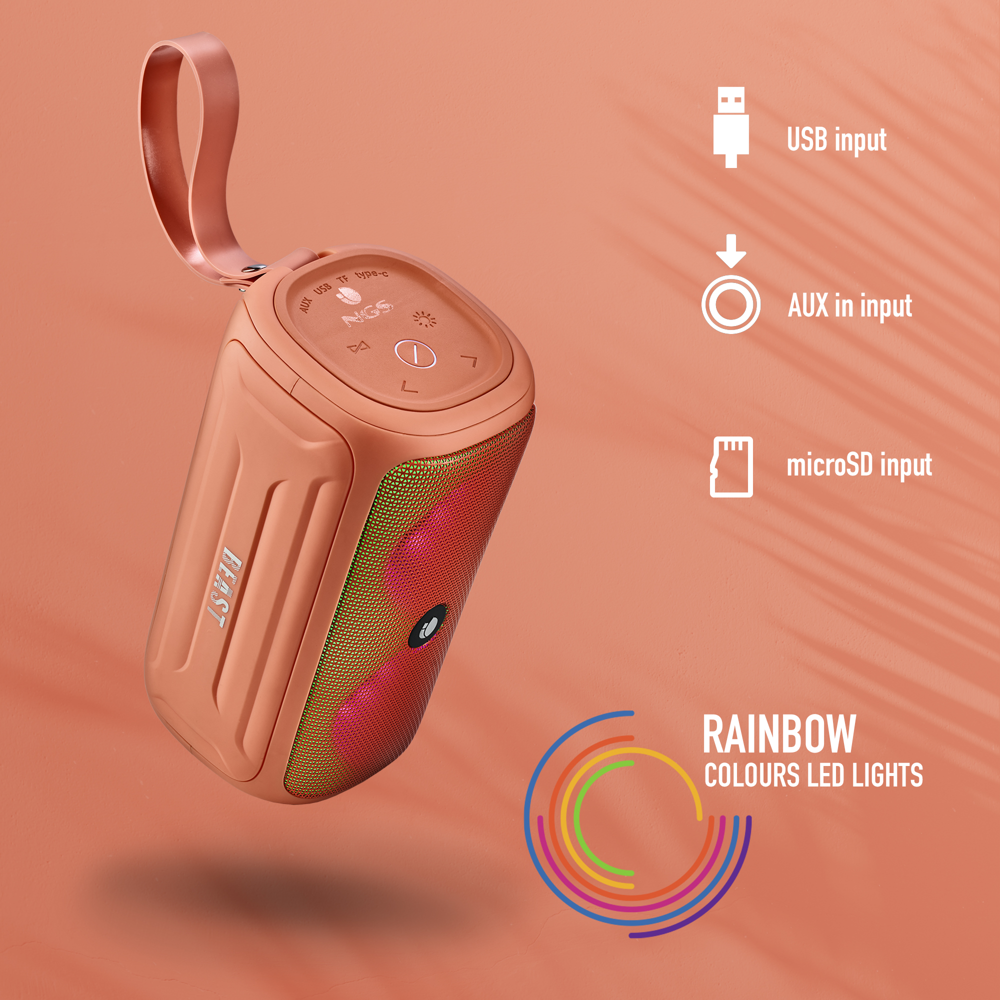 Pomarańczowy głośnik z tęczowymi diodami LED, opcje wejścia na białym tle.