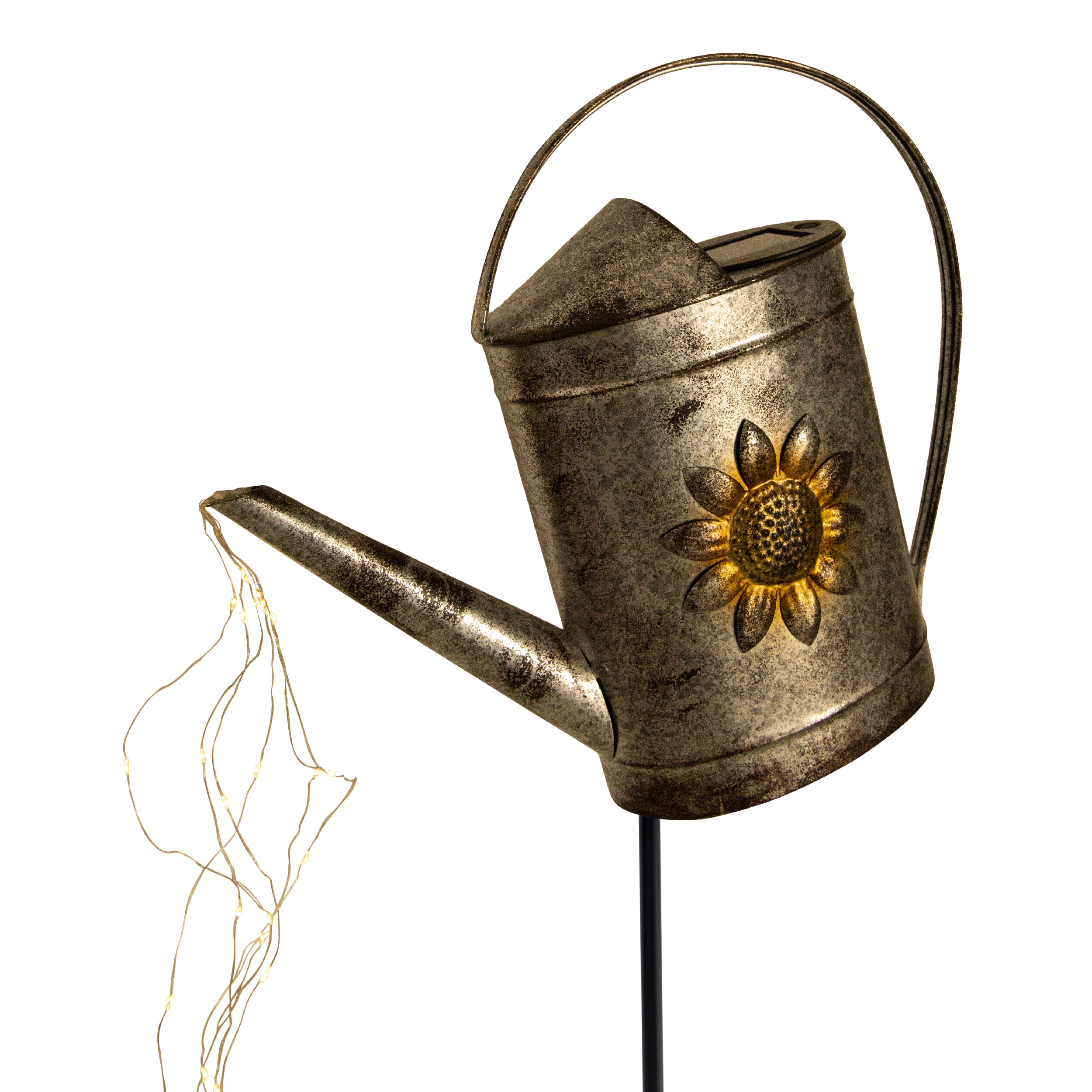 Silberne Gießkanne mit Sonnenblumen-Detail, Lichterketten aus dem Ausguss.