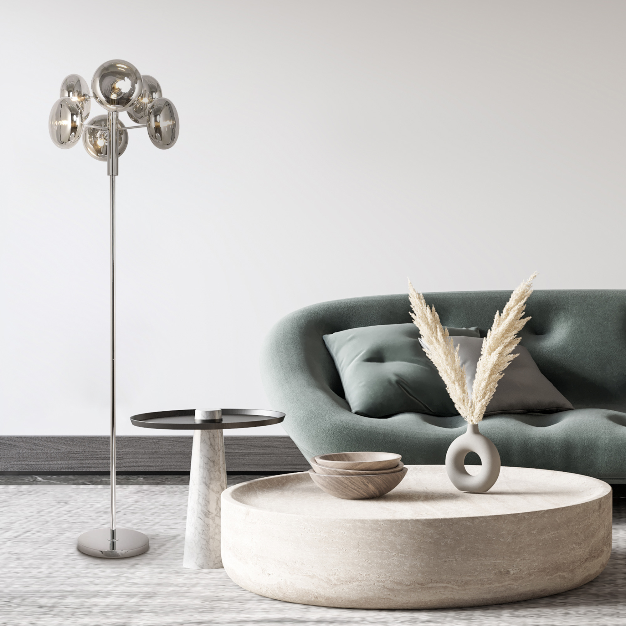 Ein modernes Wohnzimmer mit Sofa, Lampe und rundem Tisch.