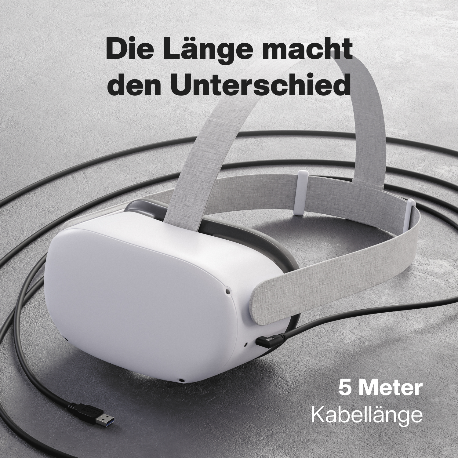 Ein VR-Headset und ein langes schwarzes Kabel liegen auf einer grauen Oberfläche. Text oben und unten.