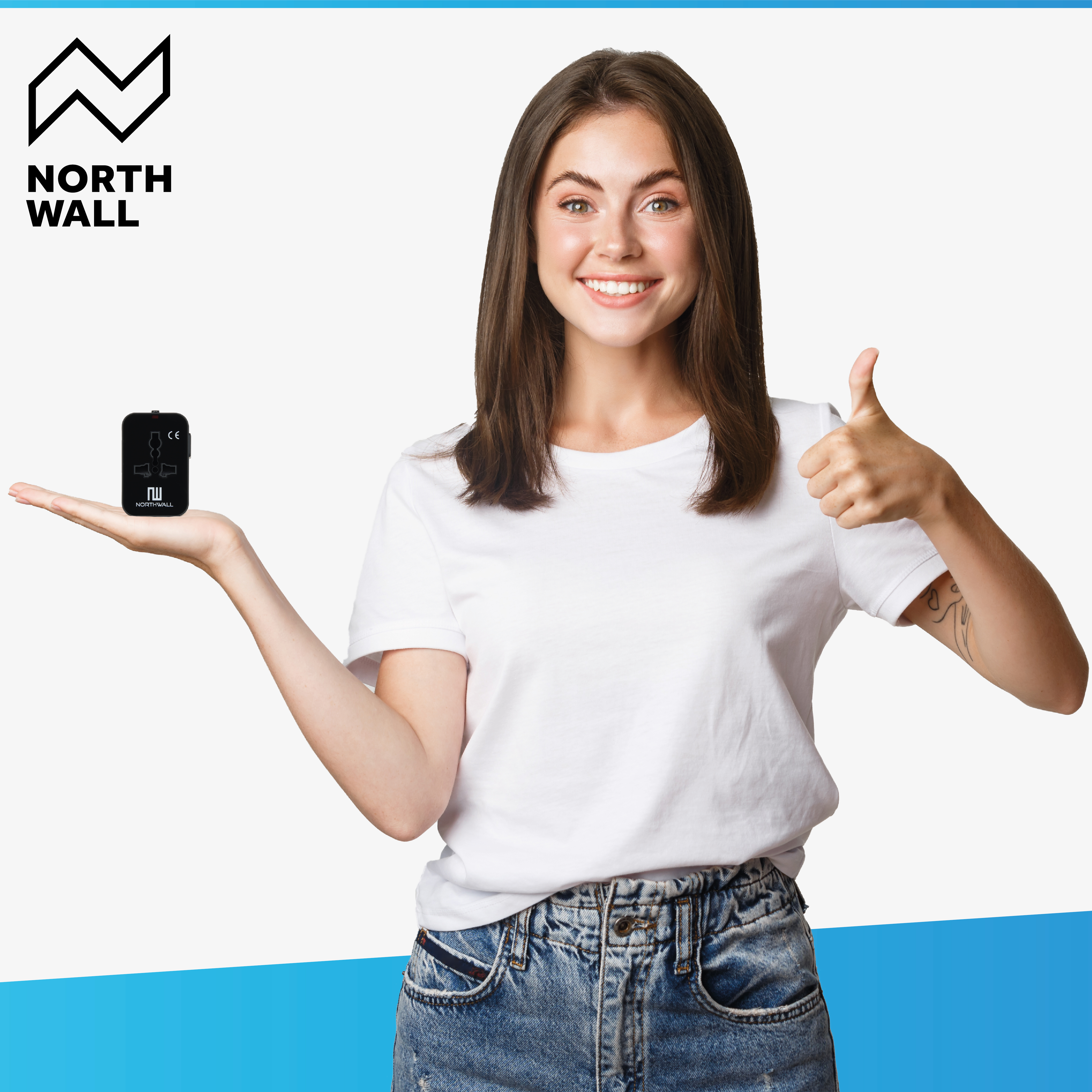 Woman holding a small black device, North Wall logo. Smiling, thumbs up.