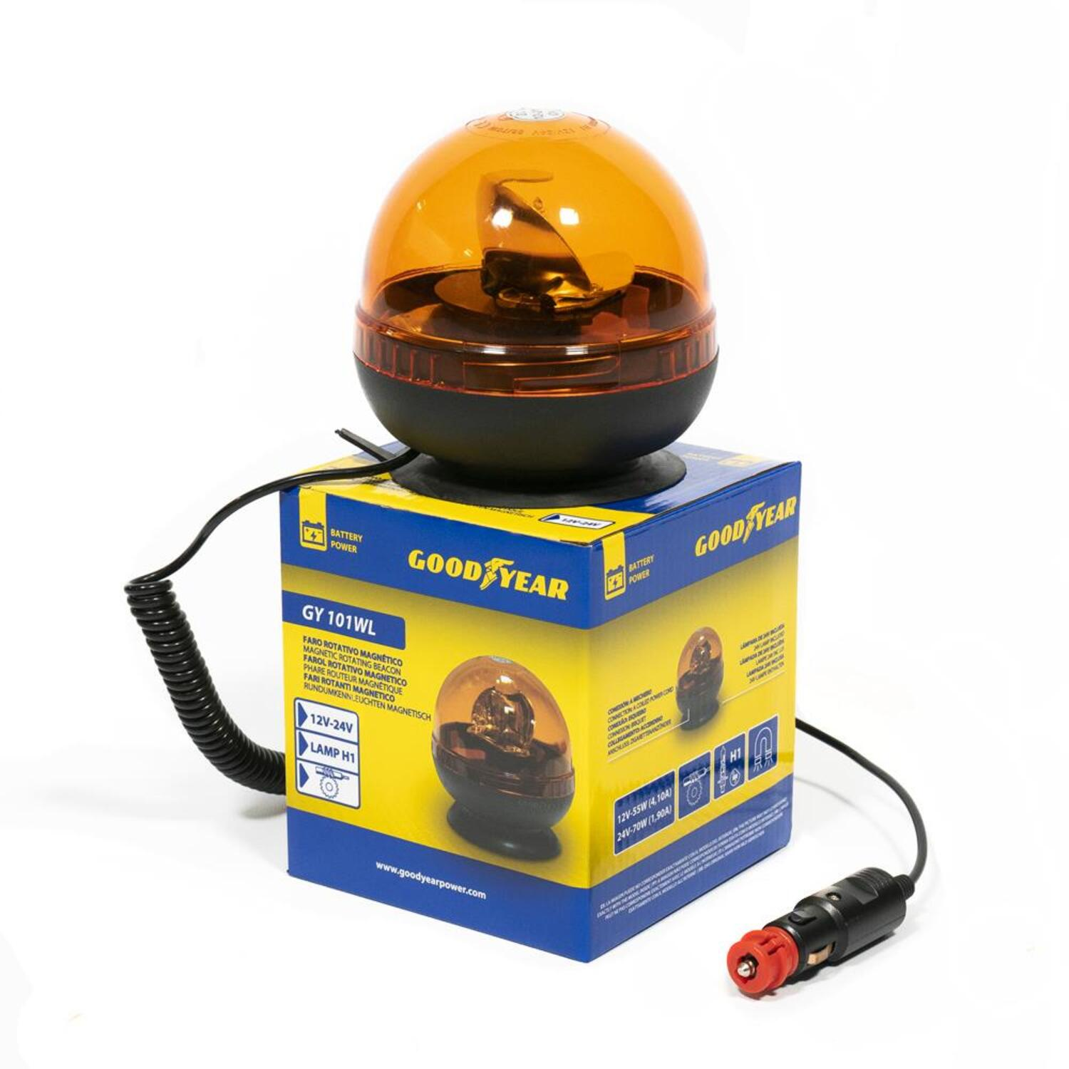 Luz de advertencia Goodyear en una caja. Luz naranja, base negra, caja azul.
