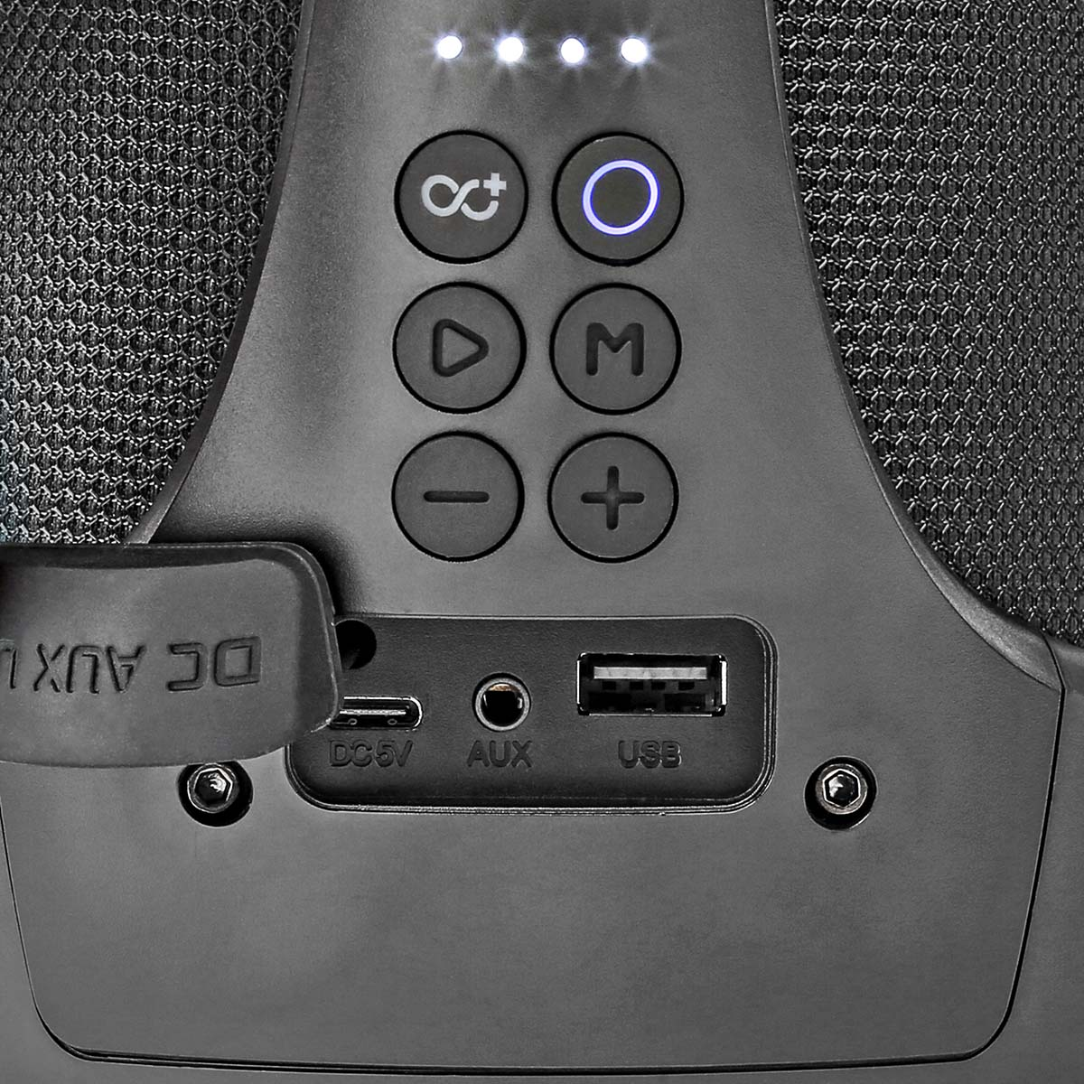 Czarne urządzenie głośnikowe. Posiada przyciski sterowania i różne porty wejściowe.