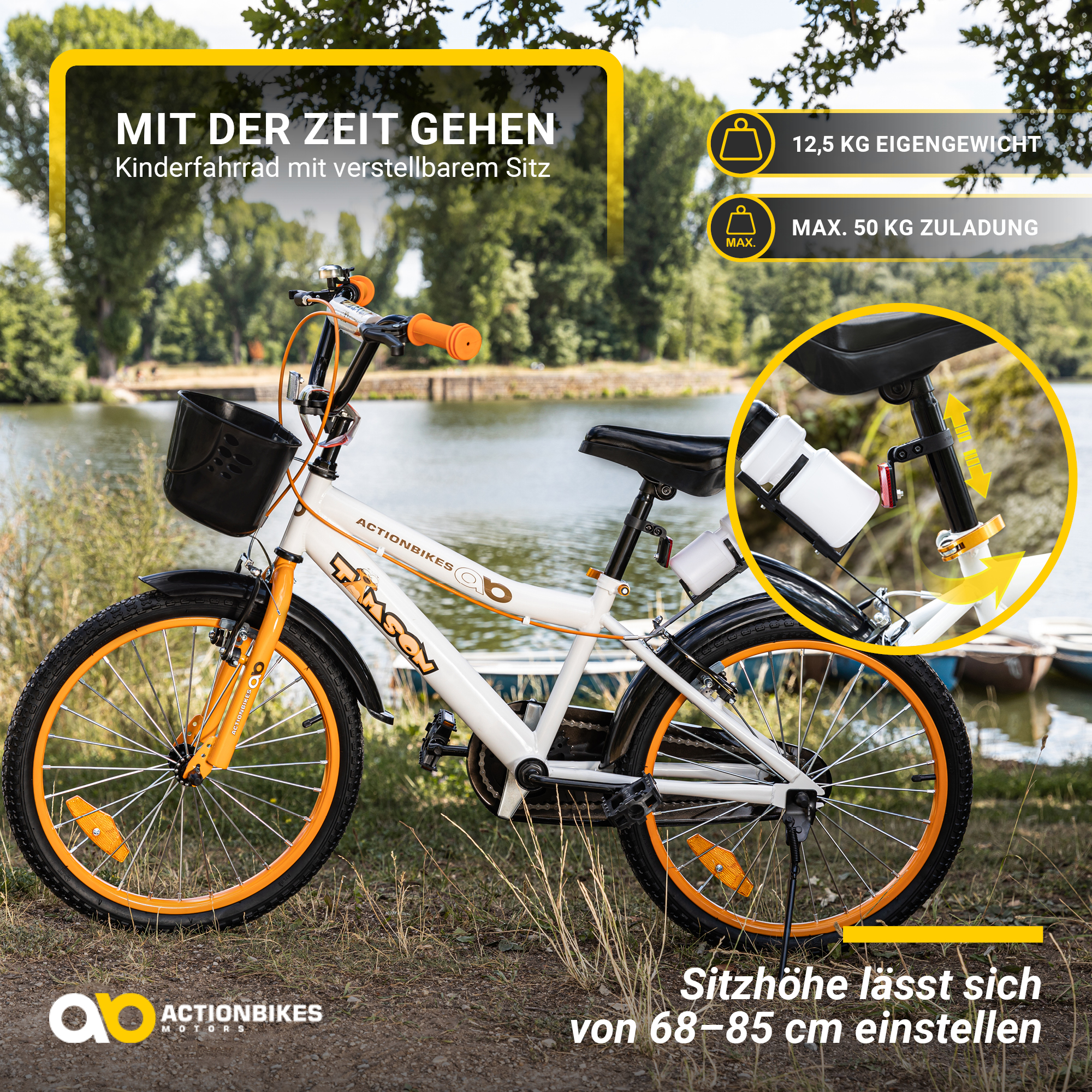 Weiß-oranges Kinderfahrrad in der Nähe eines Sees. Fahrrad hat Korb und Wasserflasche.