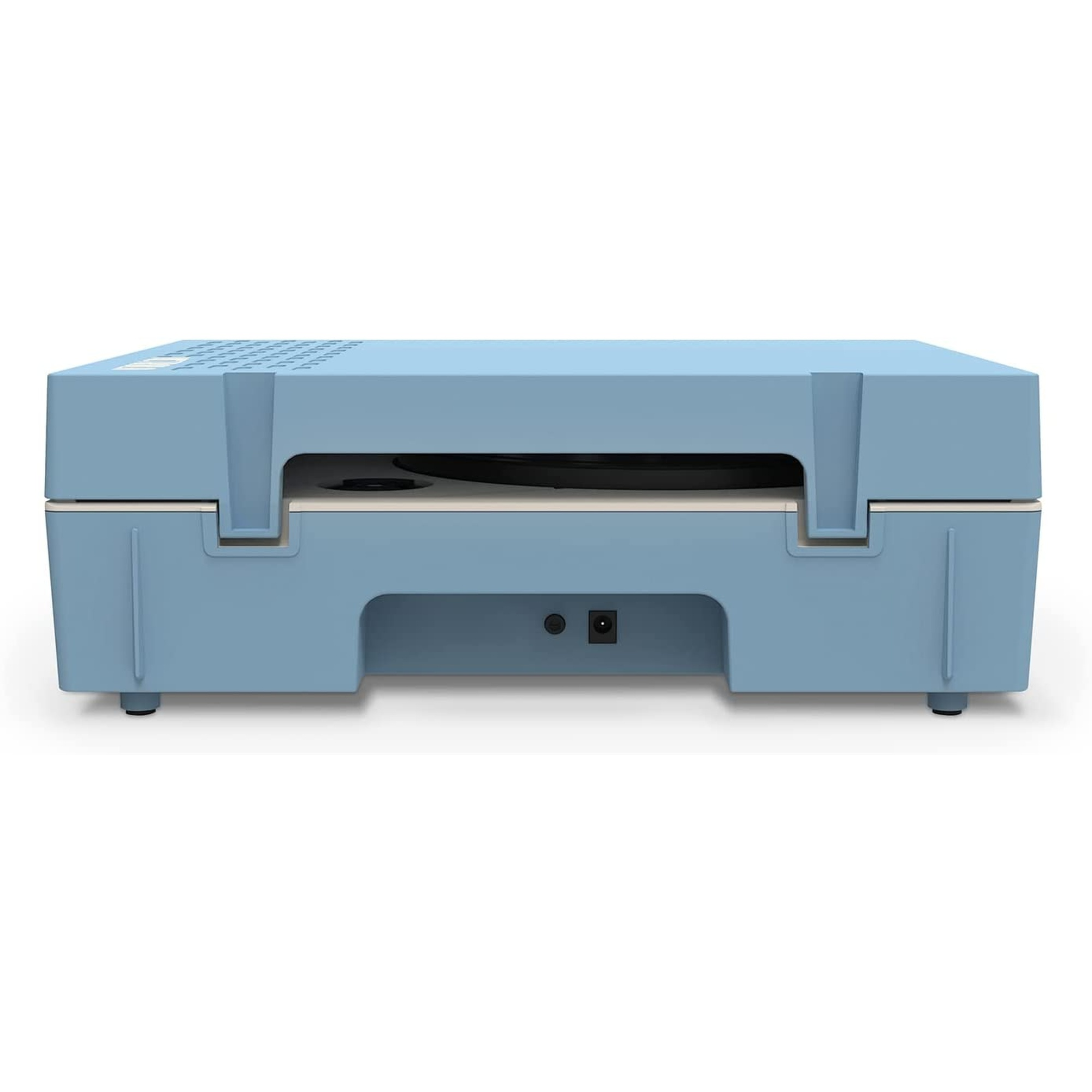 Una máquina azul claro con una parte superior curvada y un disco negro en el interior.