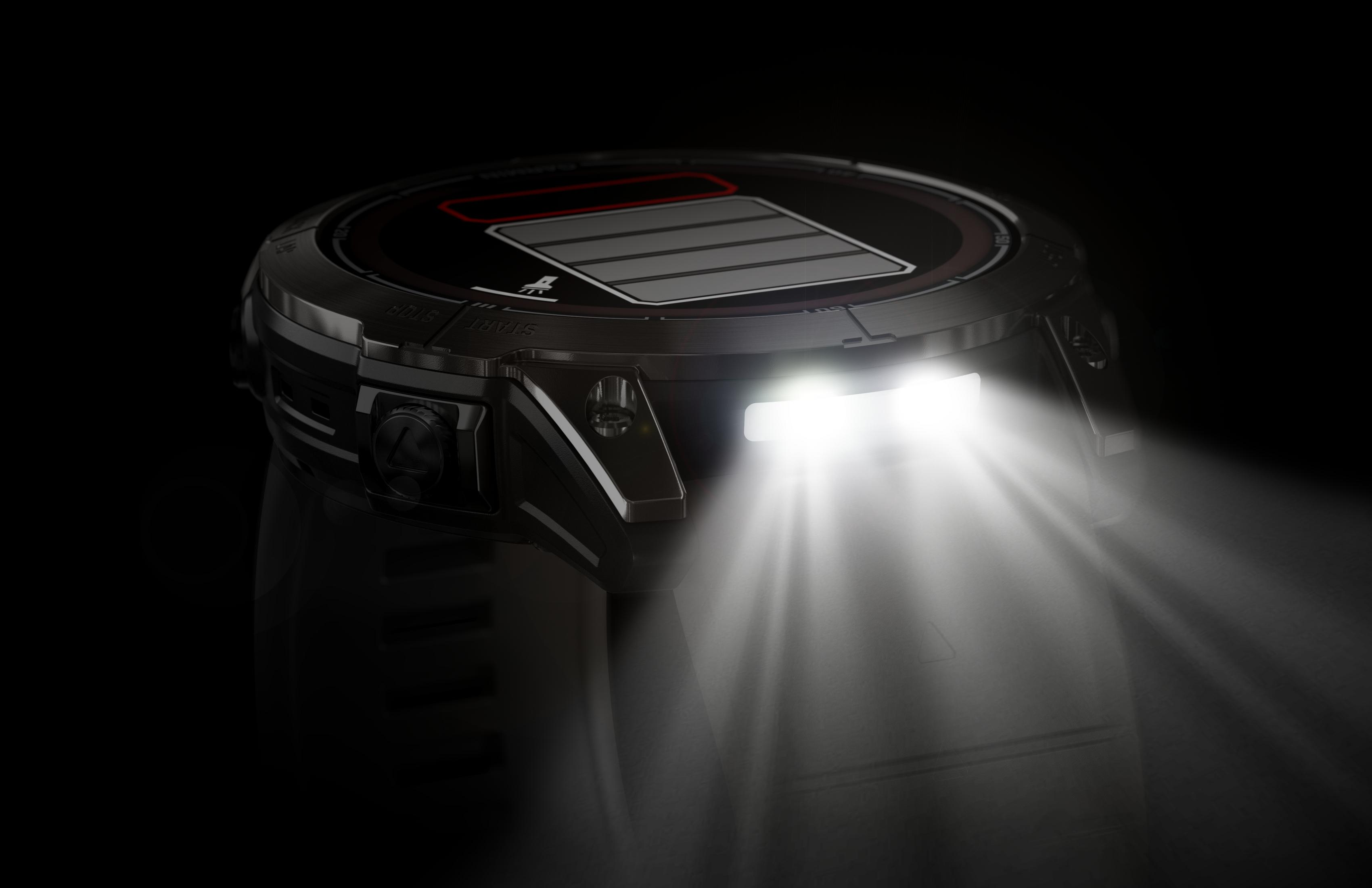 Een zwarte smartwatch met helder licht dat eruit schijnt. Het horloge staat tegen een donkere achtergrond.