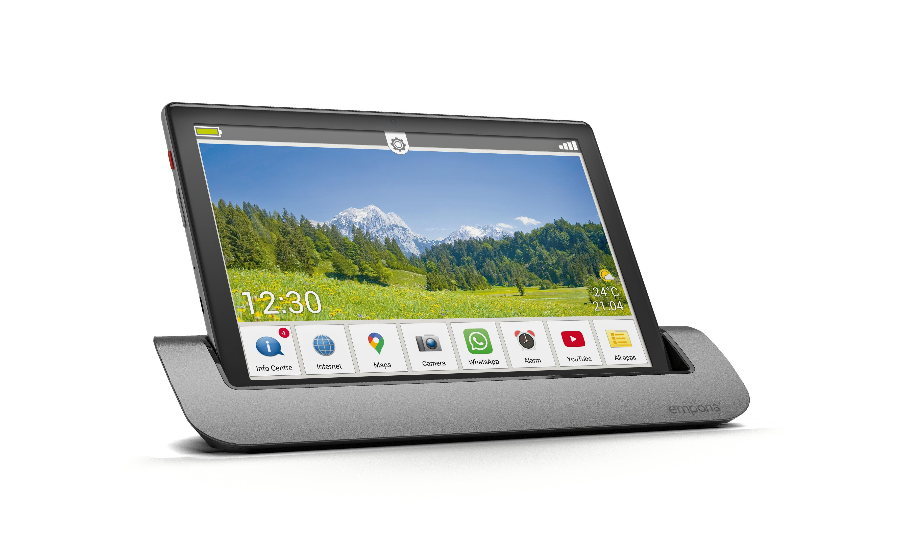 Tablet-Computer auf einem Ständer, zeigt eine farbenfrohe Landschaft und App-Symbole.