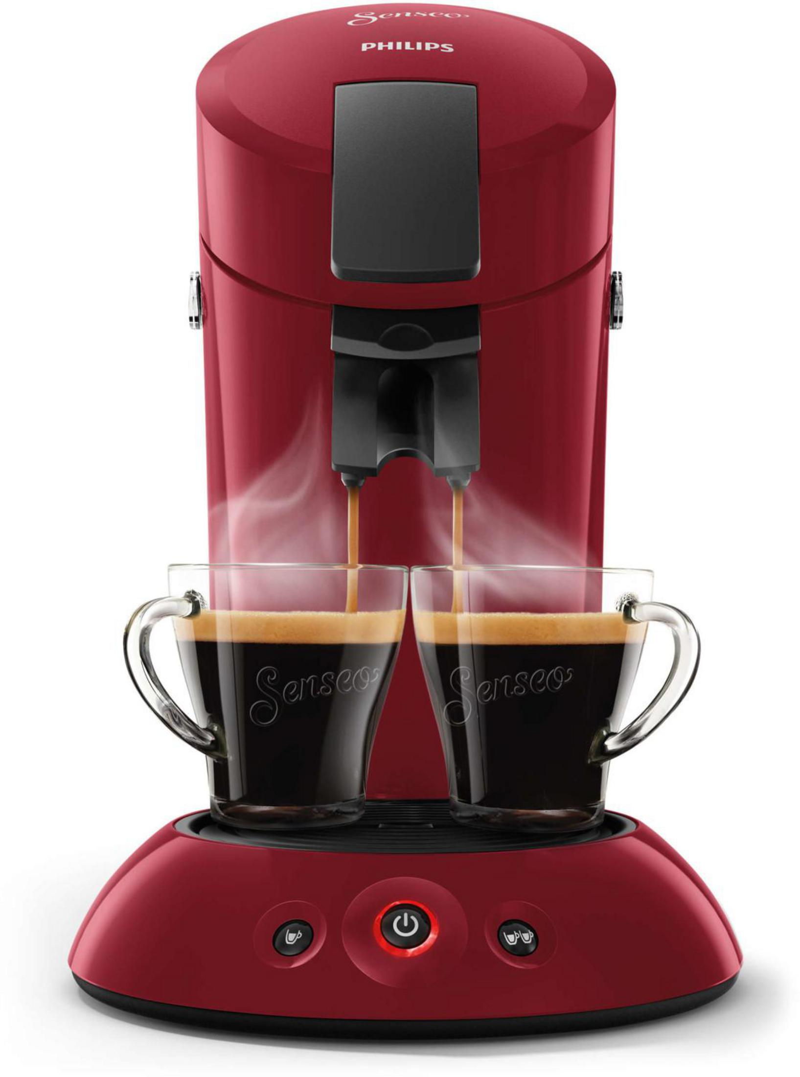Macchina da caffè Philips Senseo rossa. Due tazze si riempiono, vapore che sale. Base rossa.
