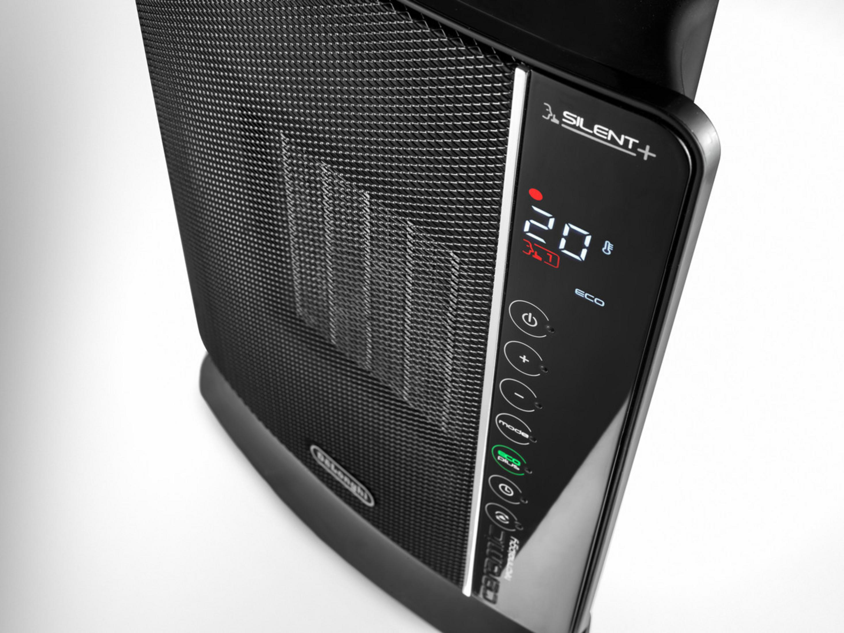 Zbliżenie czarno-szarego ekspresu Nespresso, pokazujące górę z dźwignią.