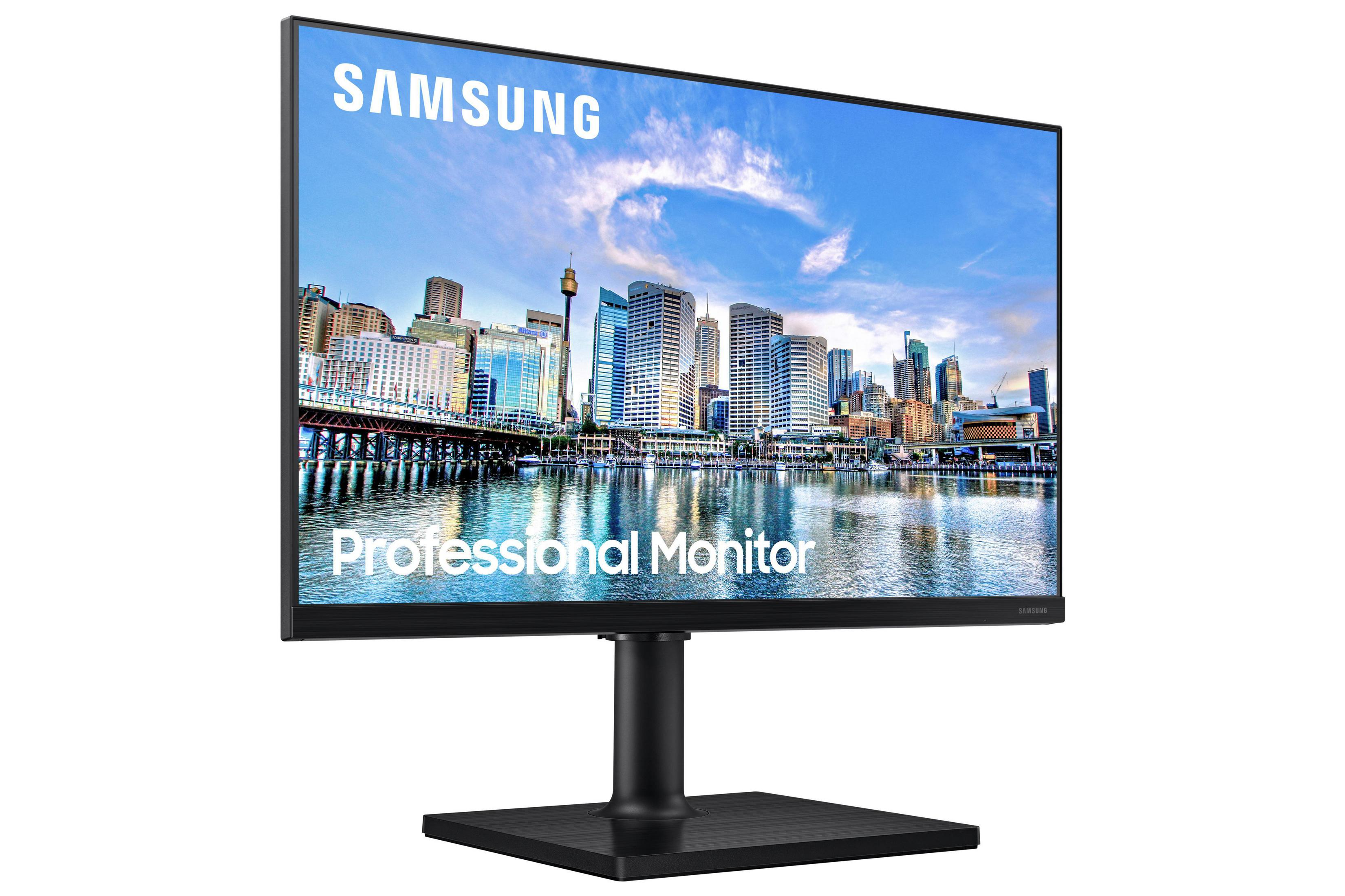 Monitor profesional mostrando horizonte de ciudad con base y soporte negro.