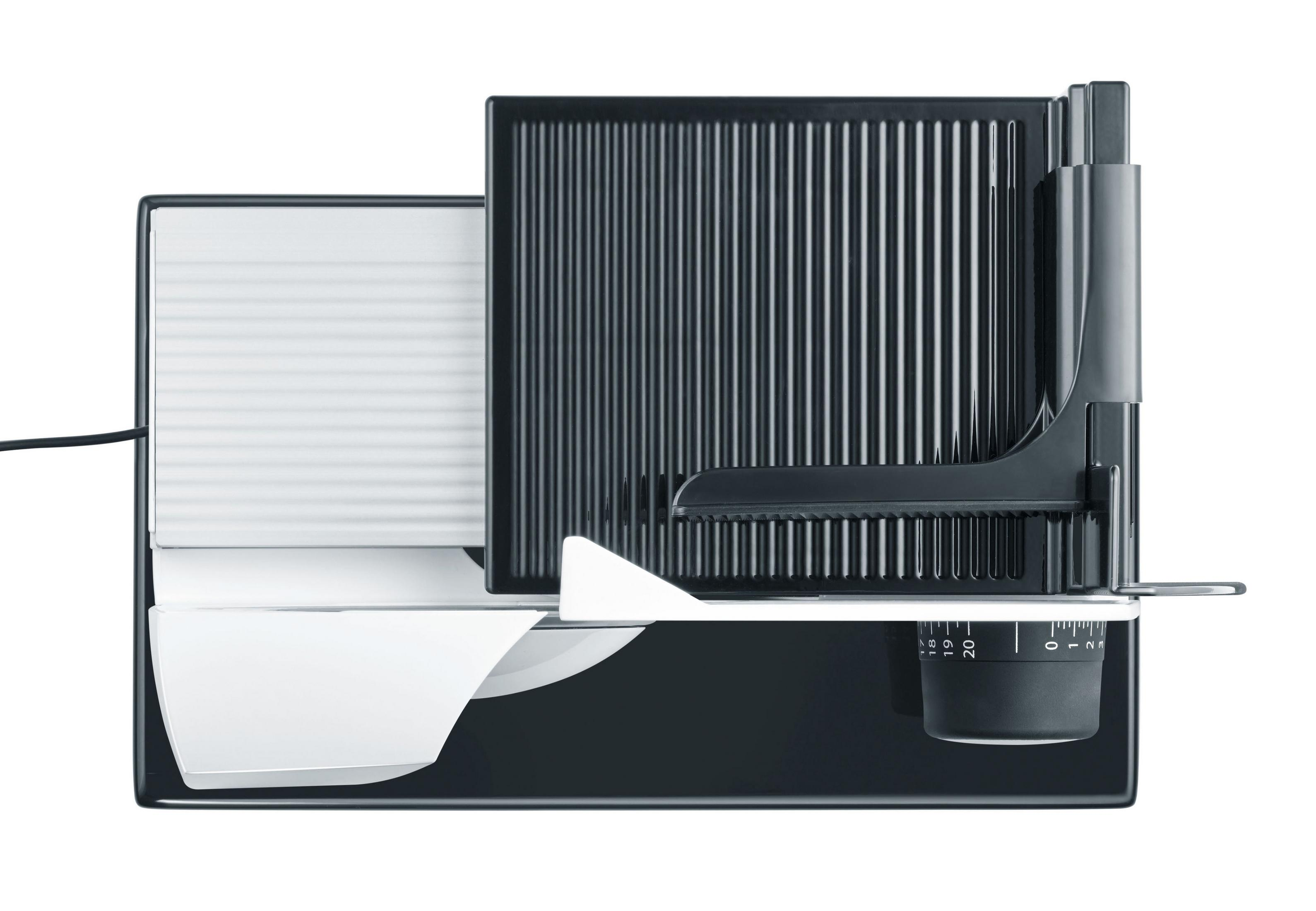 Widok z góry na czarno-białą krajalnicę do żywności z ostrzem.