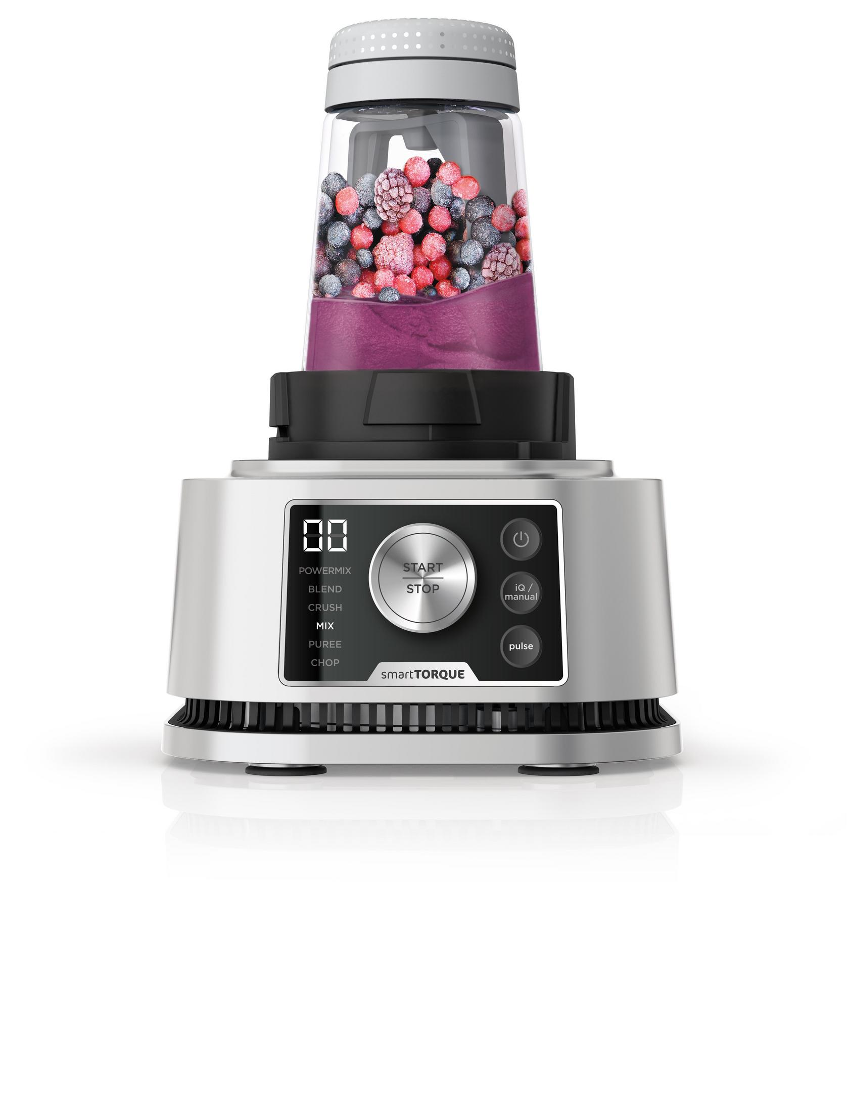 Blender with frozen berries, on silver base with digital display and buttons.