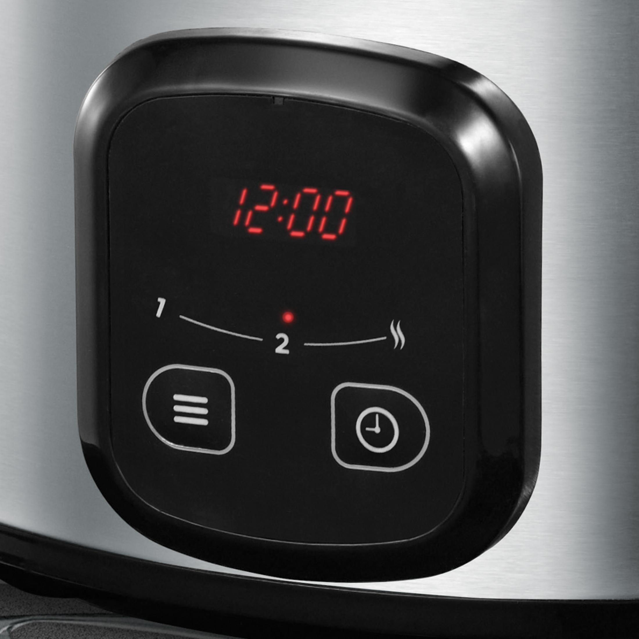 Primo piano di un pannello di controllo. Mostra le 12:00 e ha due pulsanti.
