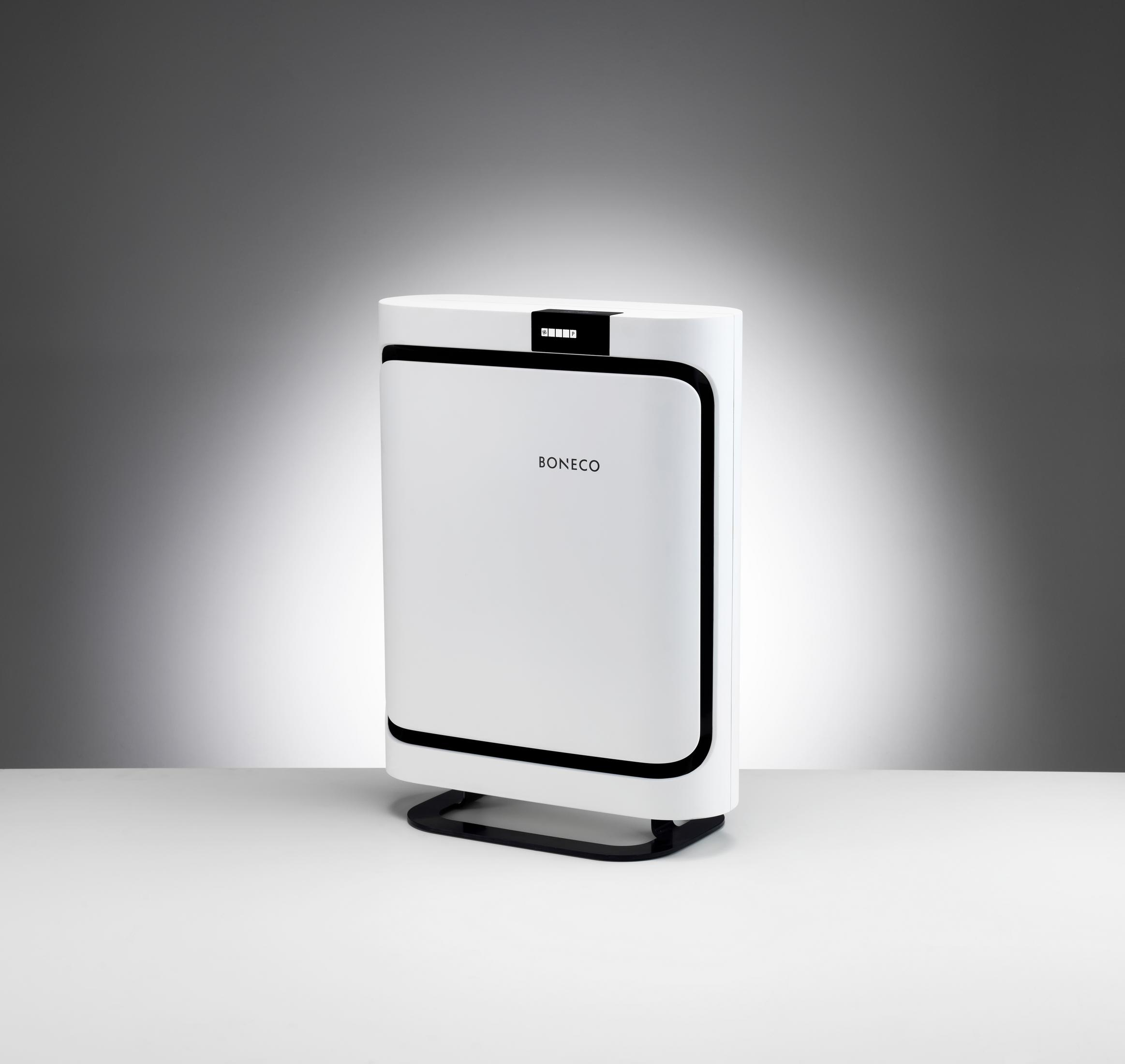 Purificador de aire blanco con base y borde negros. La marca 'BONECO' es visible en el frente.