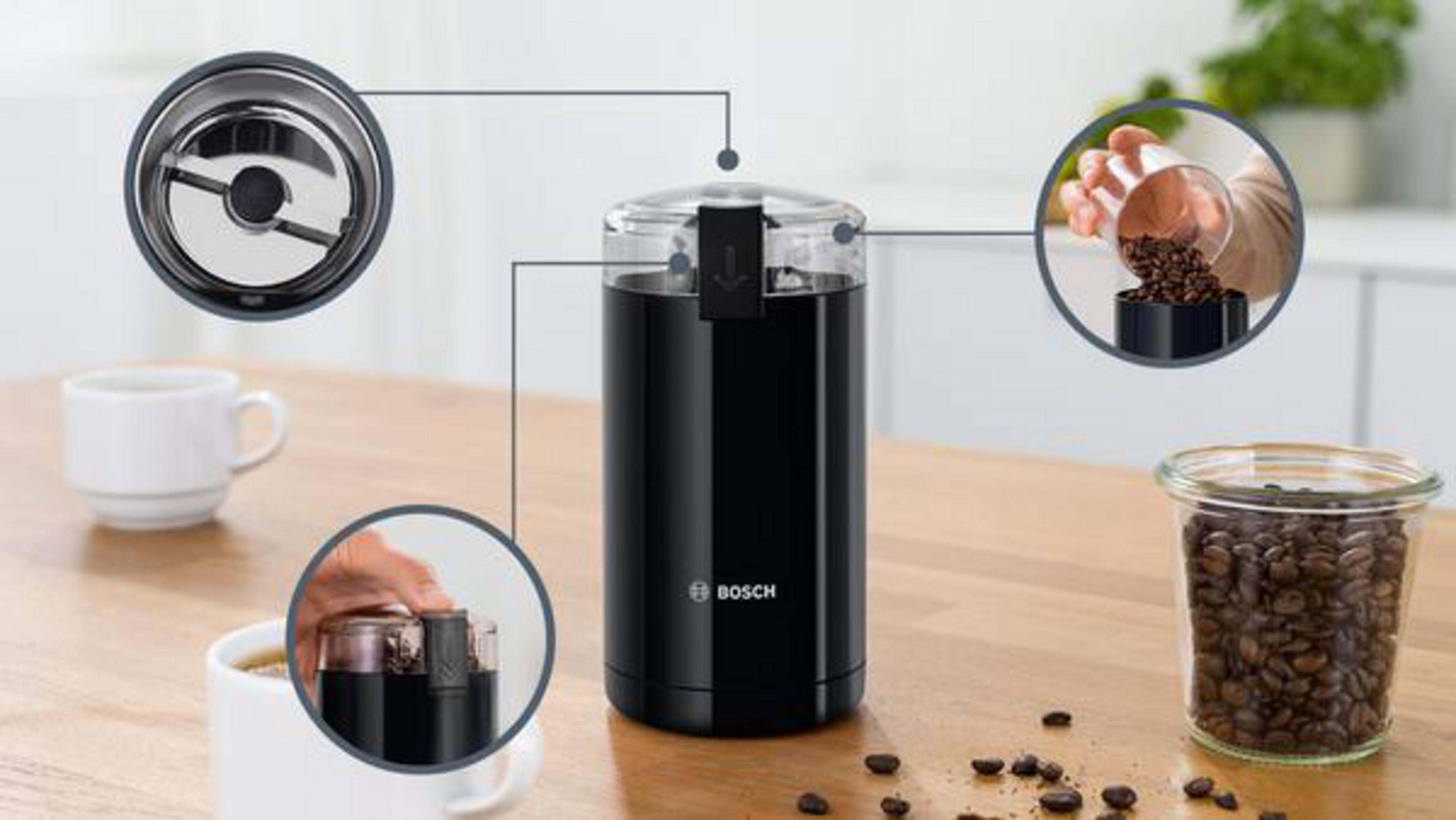 Coffee grinder with coffee beans. Close-ups show the grinder's parts and use. Beans and a cup are included.