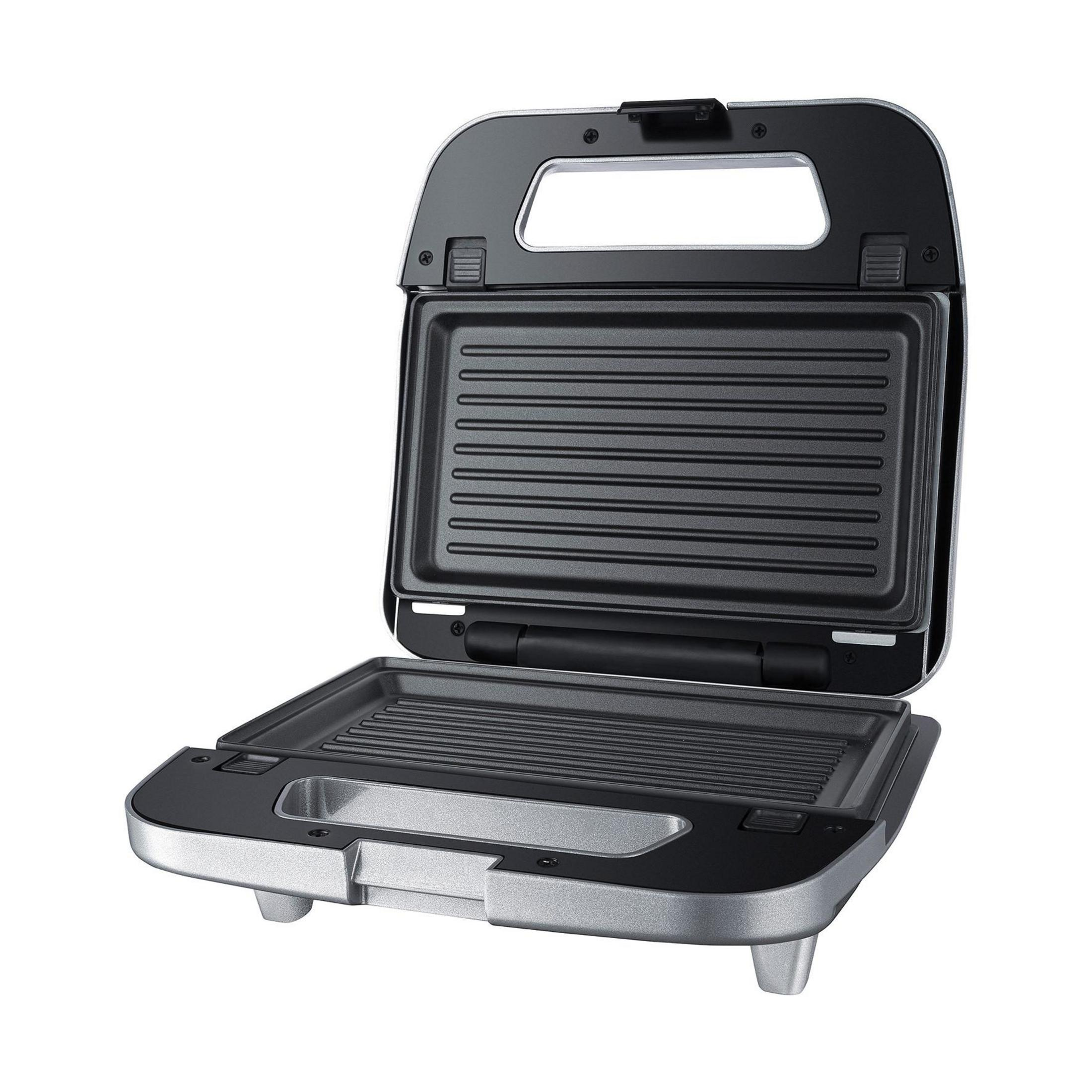 Ein offener Sandwichmaker mit Silberfinish, zeigt die Grillplatten.