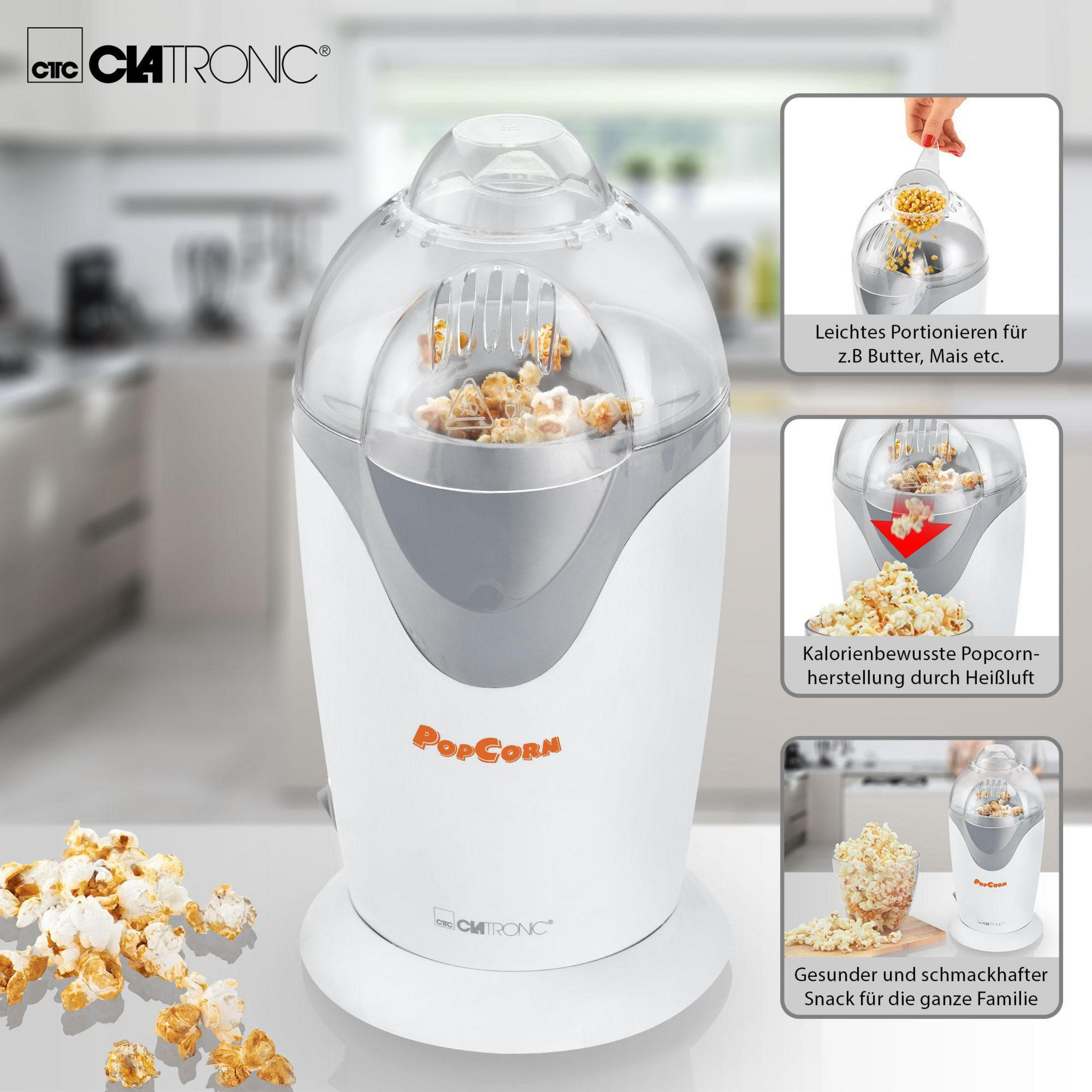 Ein weißer Popcorn-Maker mit transparentem Deckel und Popcorn innen.