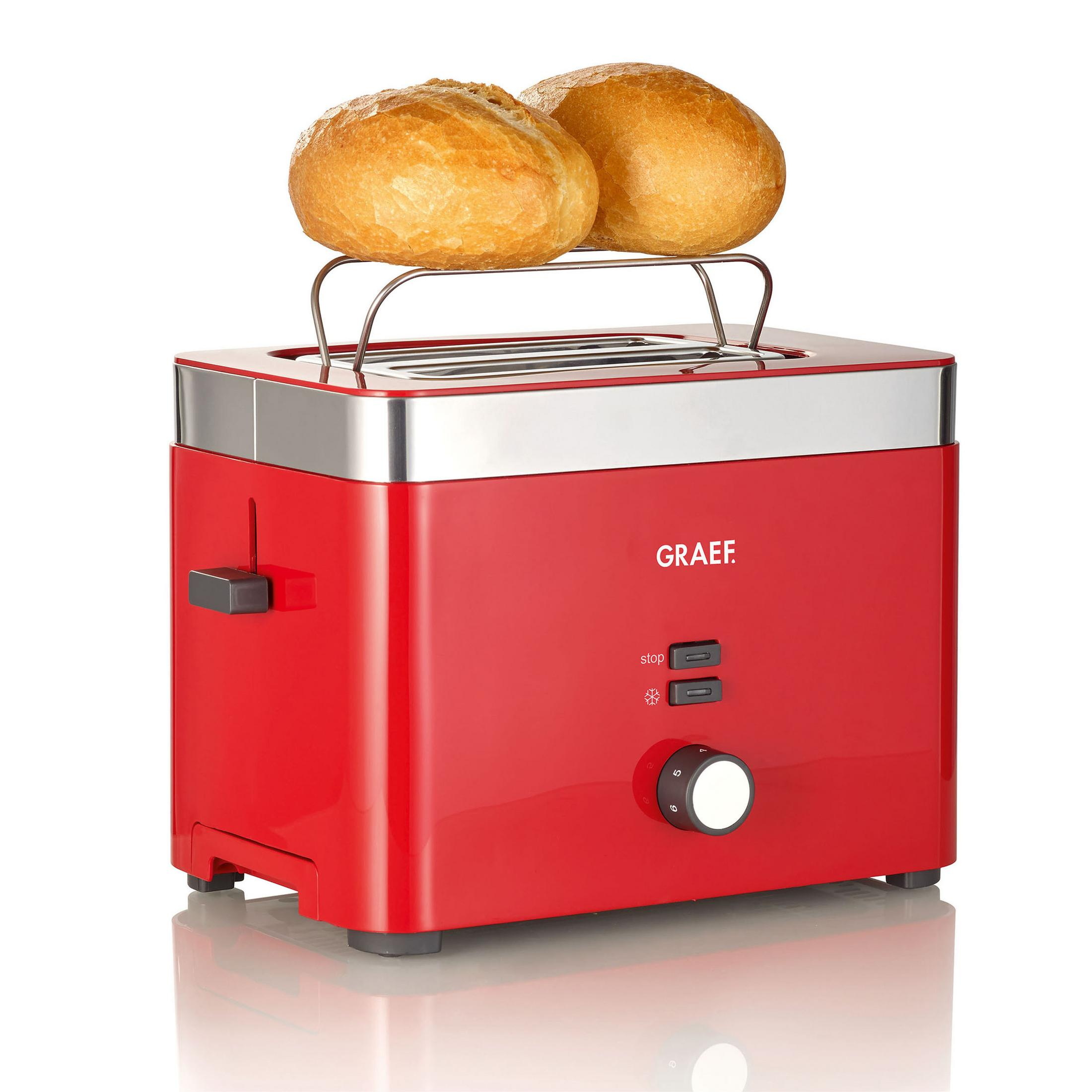 Ein roter Toaster mit zwei Brötchen oben und einem silbernen Rahmen.