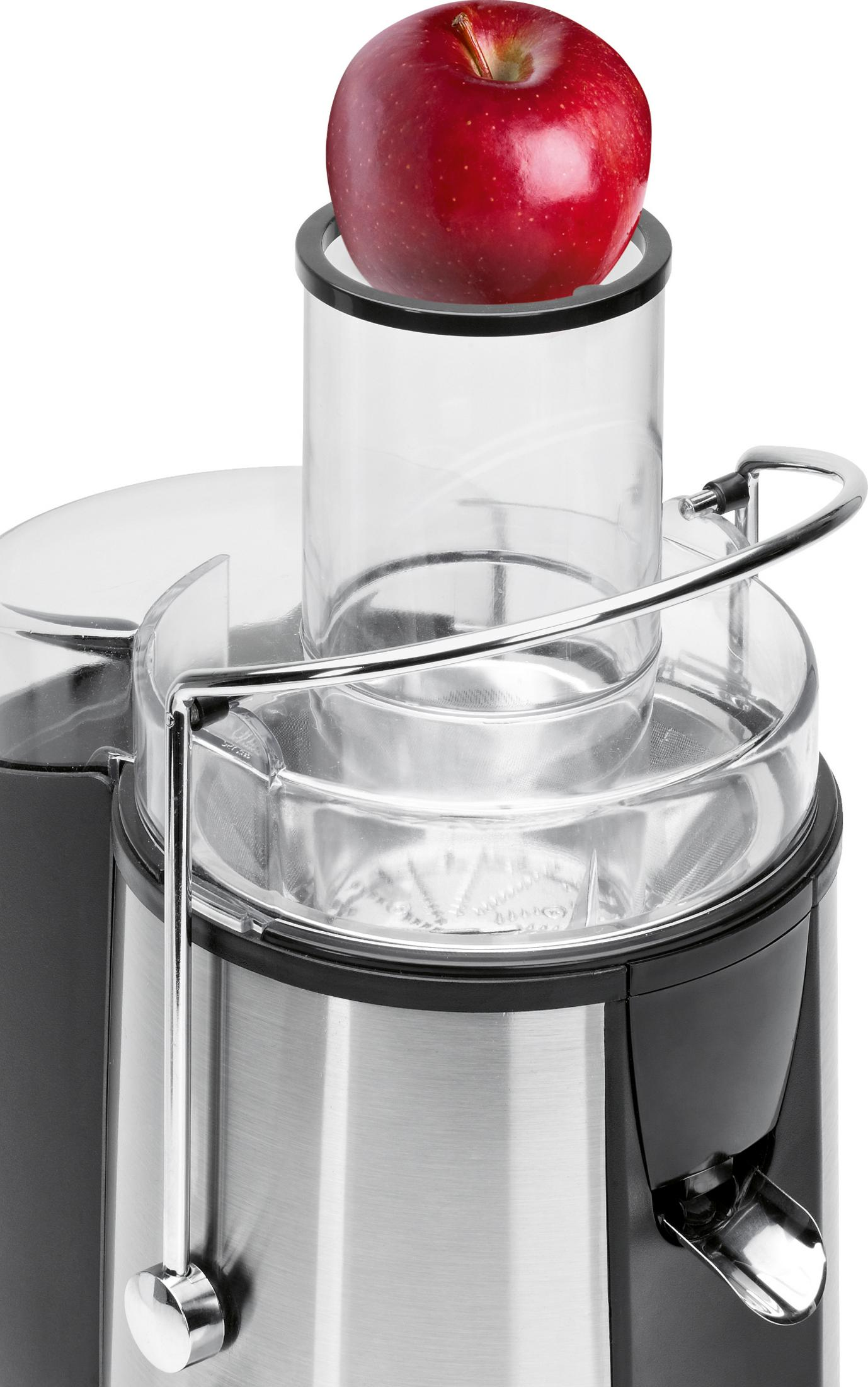Sokowirówka z czerwonym jabłkiem na górze. Srebrne i czarne urządzenie.