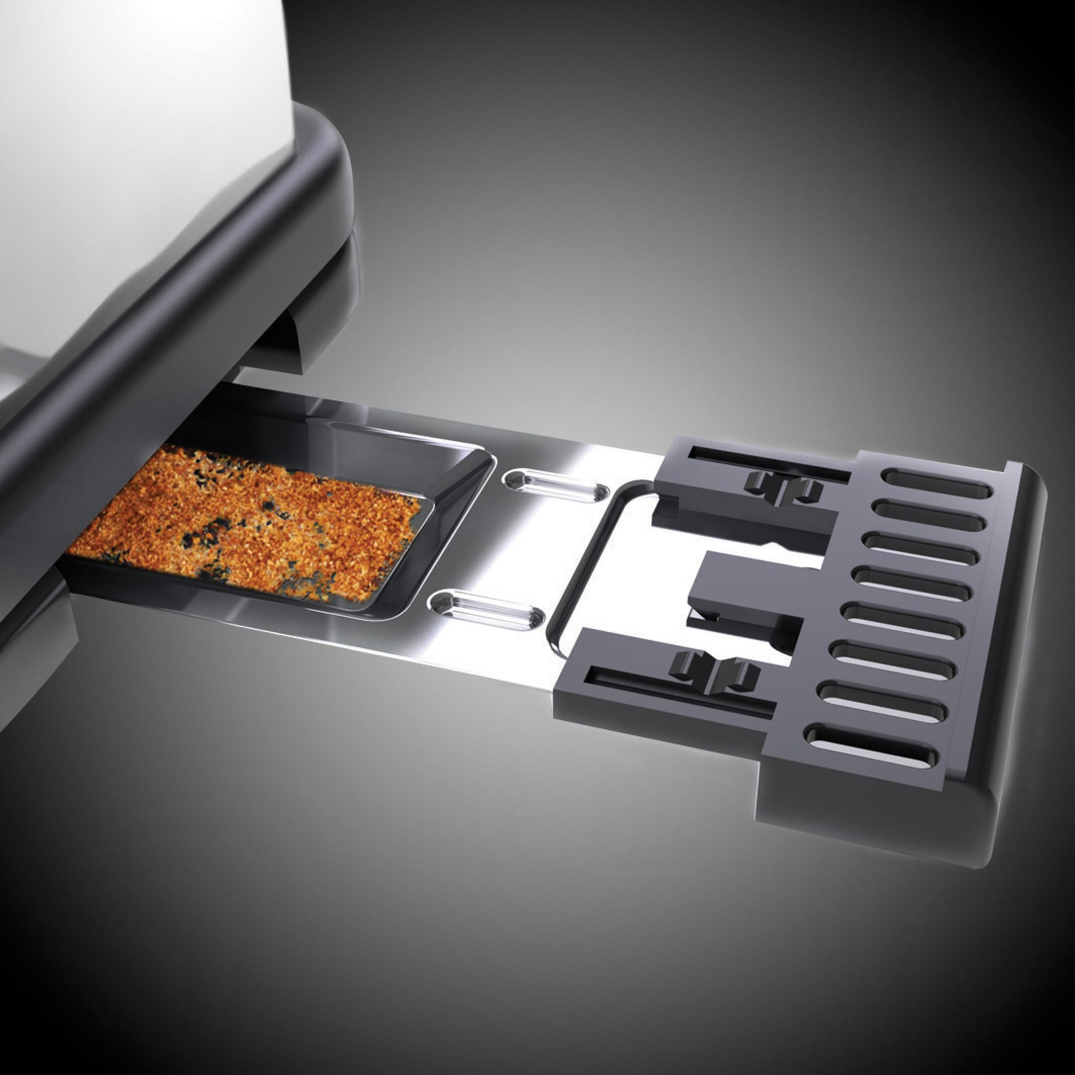 Toster z otwartą szufladą na okruchy, pokazujący spalone okruchy tostów. Szare tło.