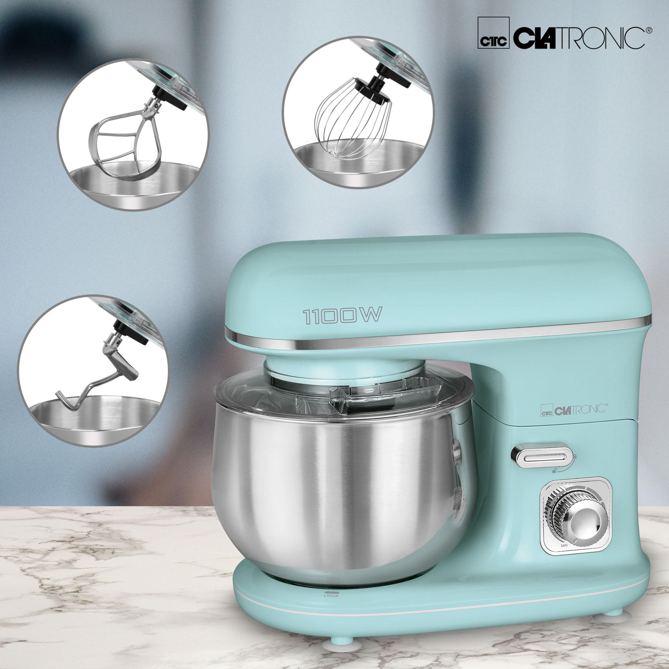 Niebiesko-zielony mikser stojący z nasadkami. Mikser ma misę ze stali nierdzewnej, ze stołem marmurowym.