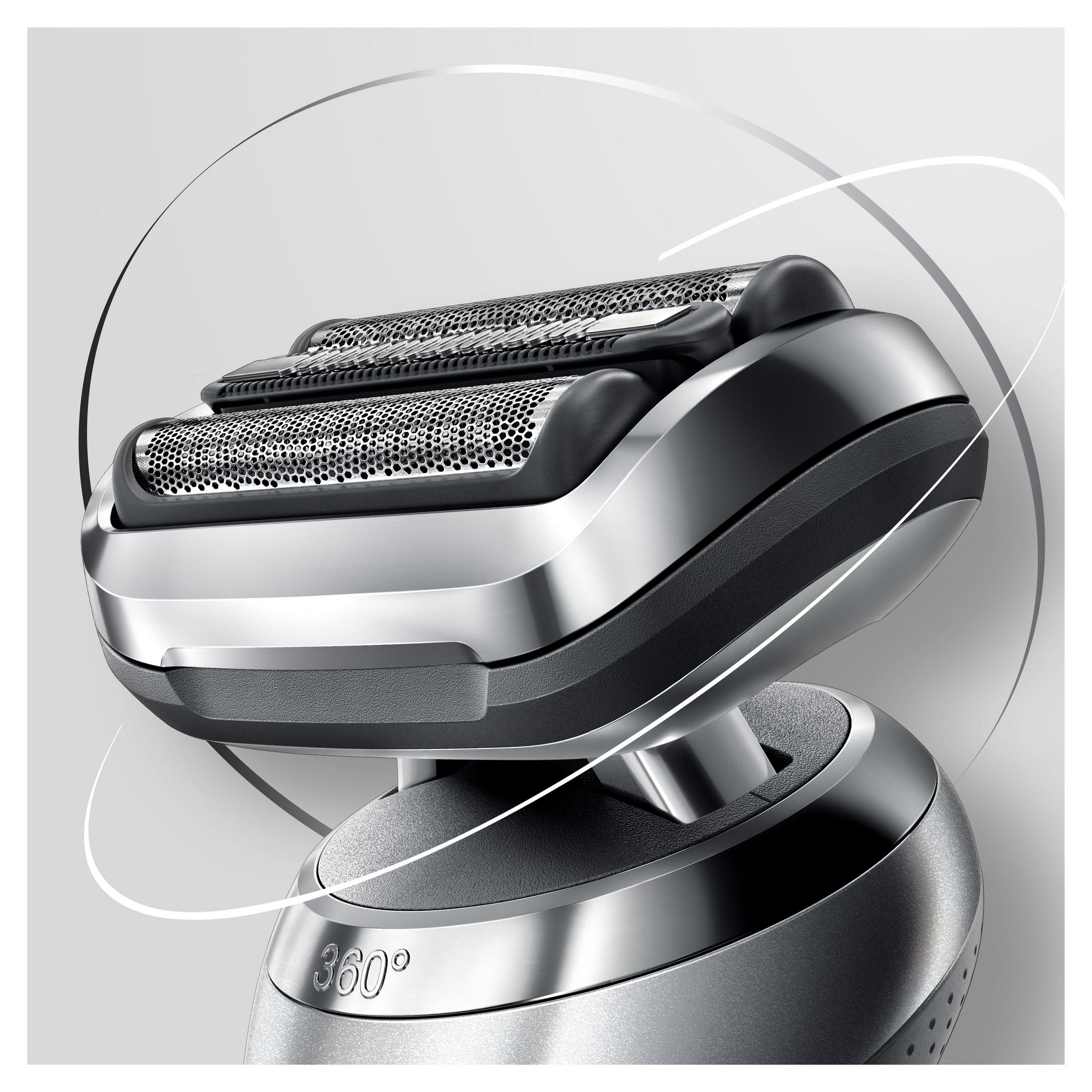 Zbliżenie srebrno-czarnej golarki elektrycznej, pokazujące głowice golące.