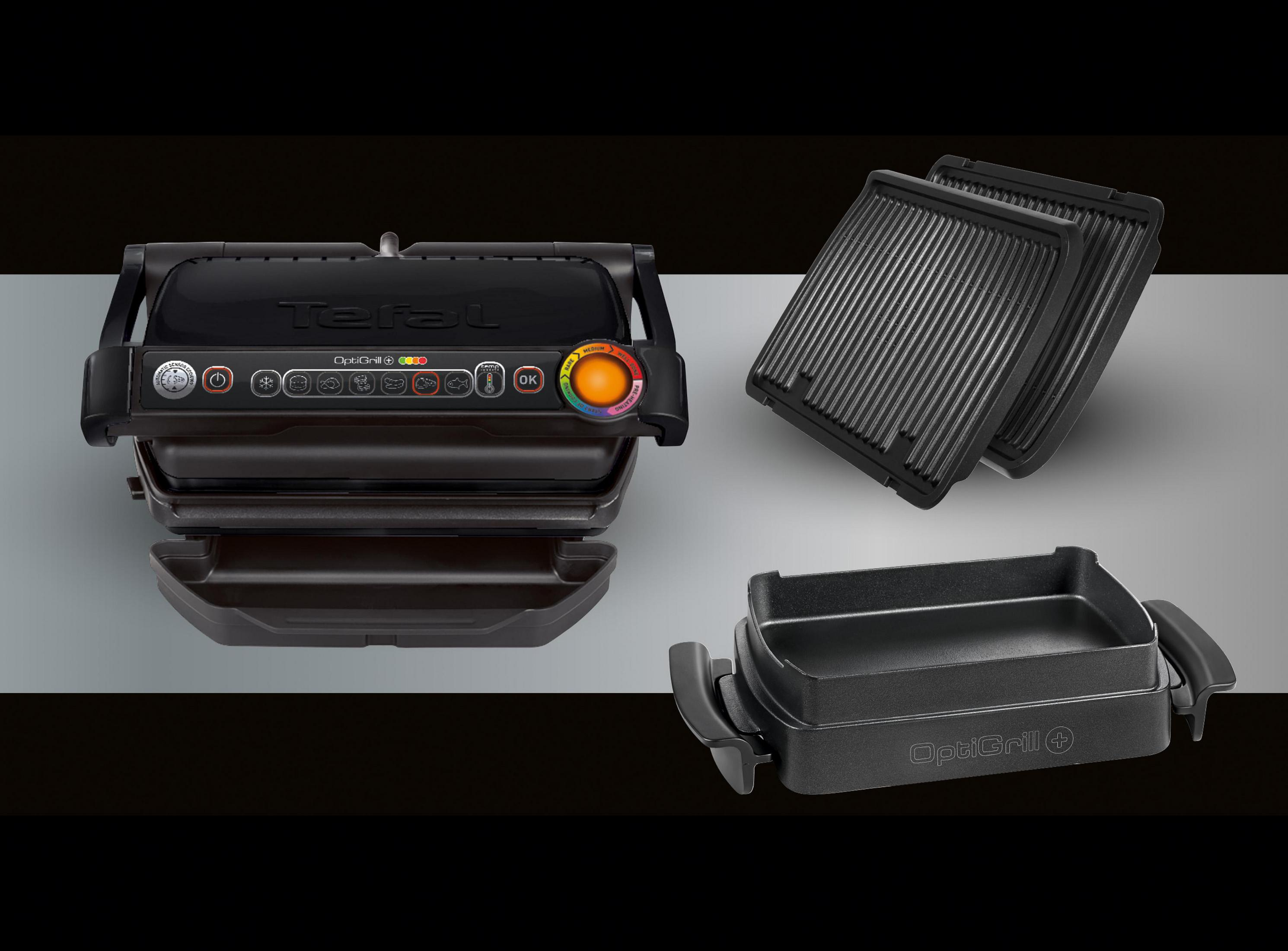 Ein schwarzer OptiGrill mit offenen Platten und abnehmbaren Teilen. Zusätzliche Platten sind rechts zu sehen.
