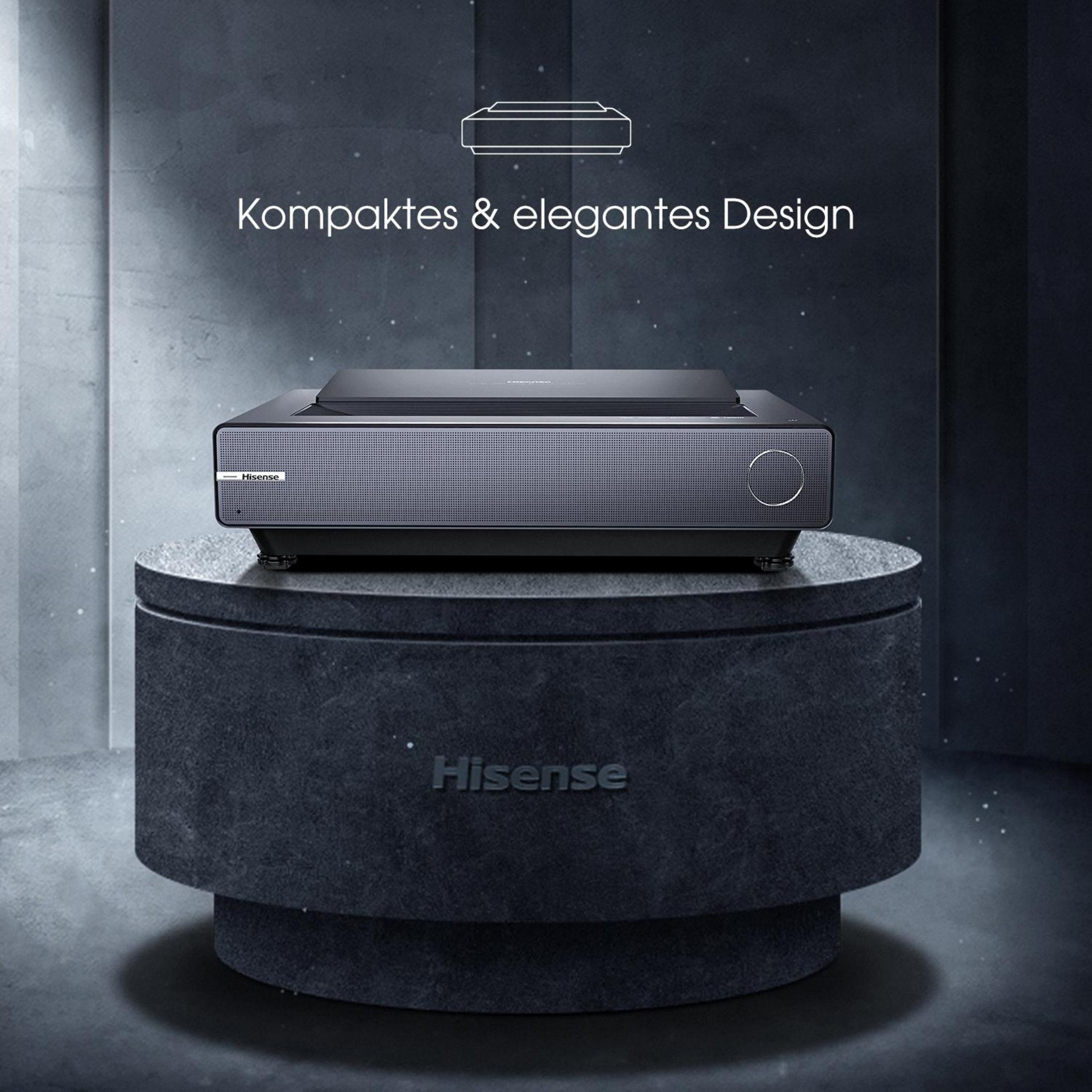 Czarny projektor na ciemnoszarym cokole. Nad nim napis 'Kompaktes & elegantes Design'.