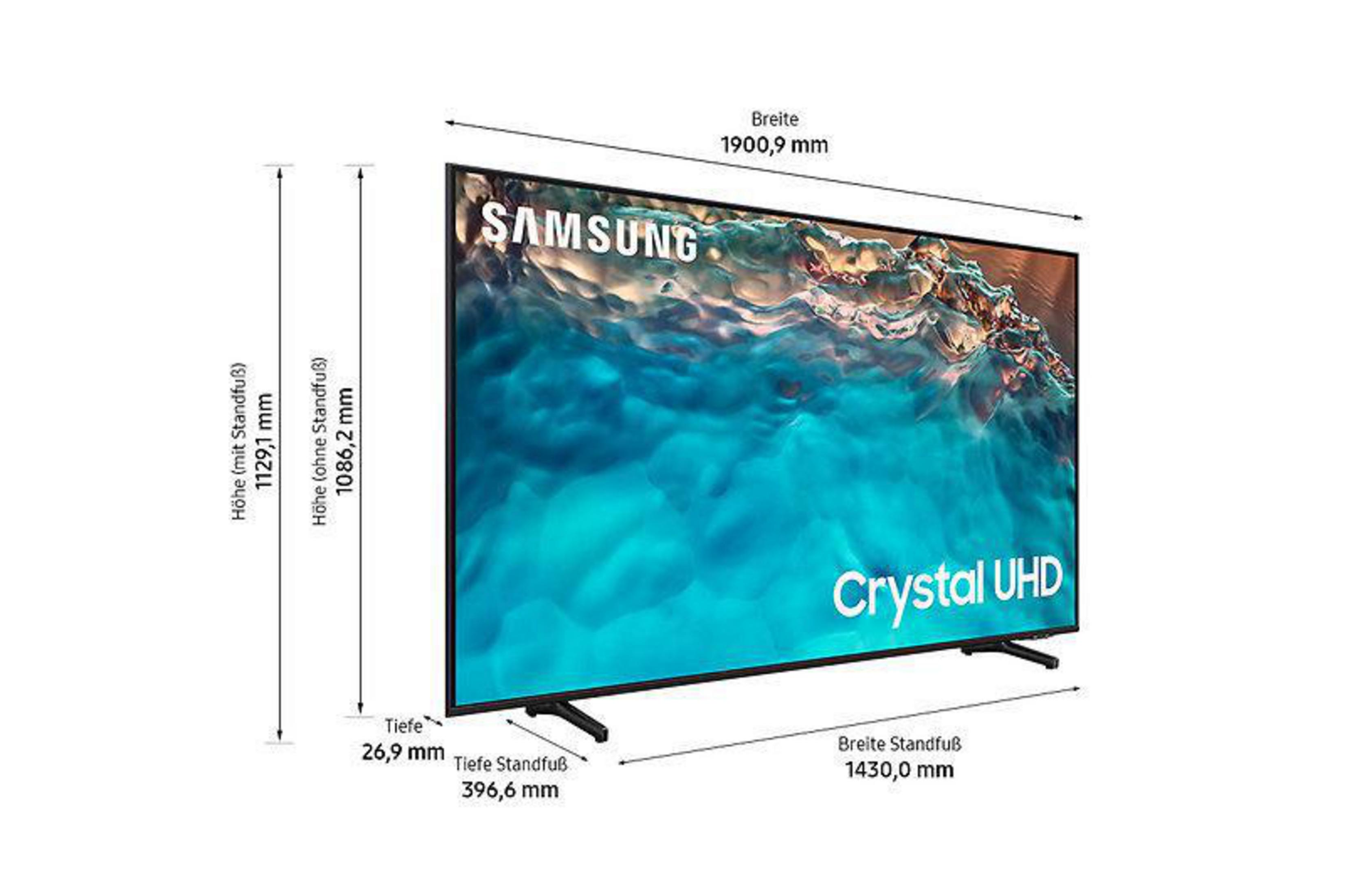 Telewizor Samsung Crystal UHD z wymiarami i szczegółami podstawy, białe tło.