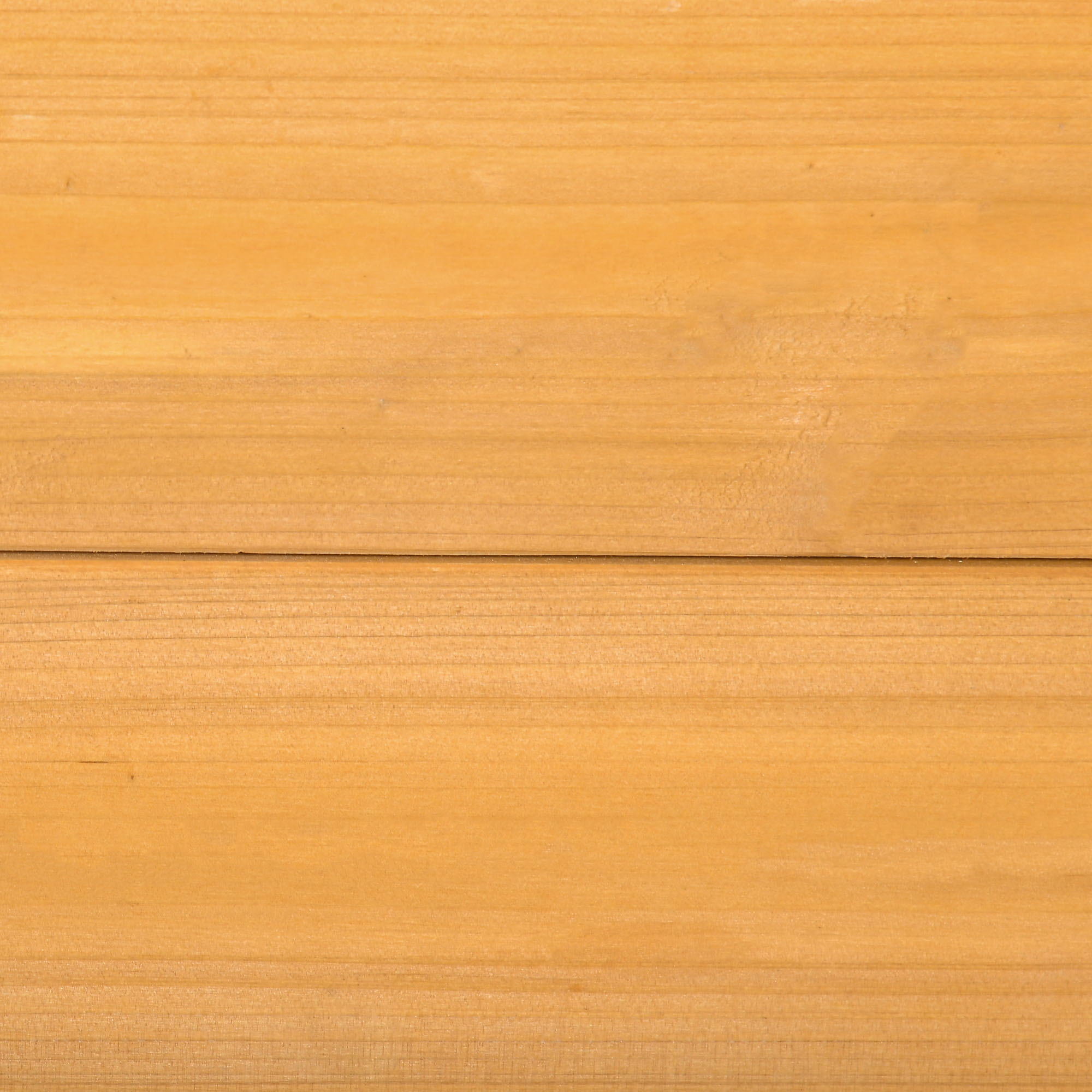 Superficie de madera con líneas horizontales. Es liso, de color amarillo-marrón y con vetas naturales.