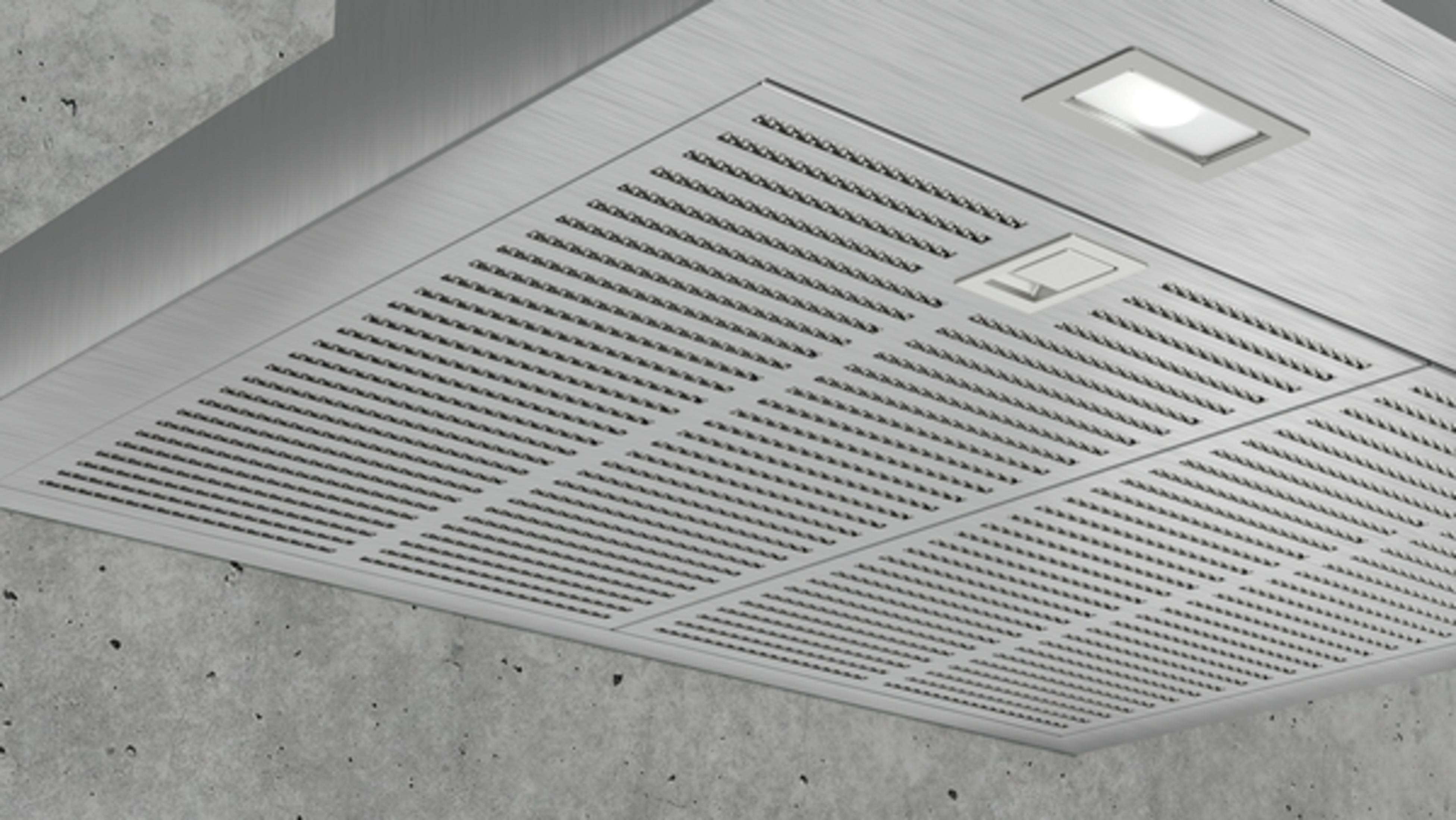 Nahaufnahme des Dunstabzugshauben-Lüfters mit Licht, metallische Oberfläche.