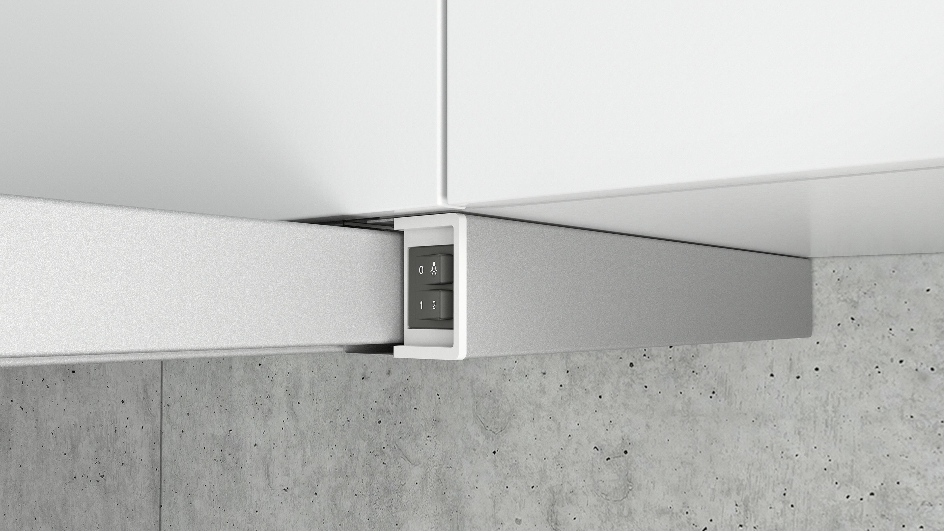 Nowoczesna szafka kuchenna z małym panelem przełączników z przyciskami do sterowania oświetleniem.