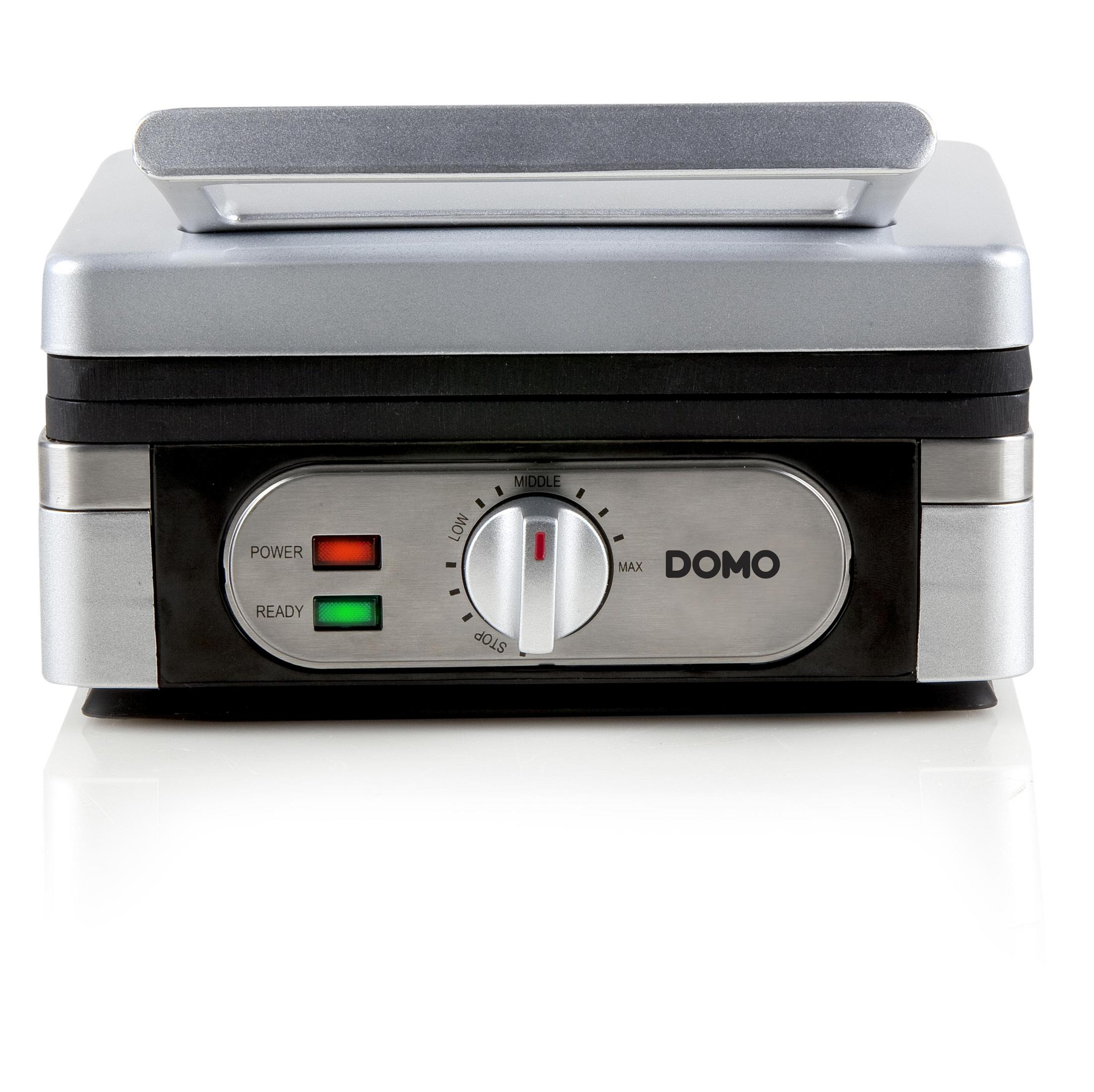 Srebrna gofrownica z czarnymi detalami, kontrolkami zasilania i gotowości oraz pokrętłem.