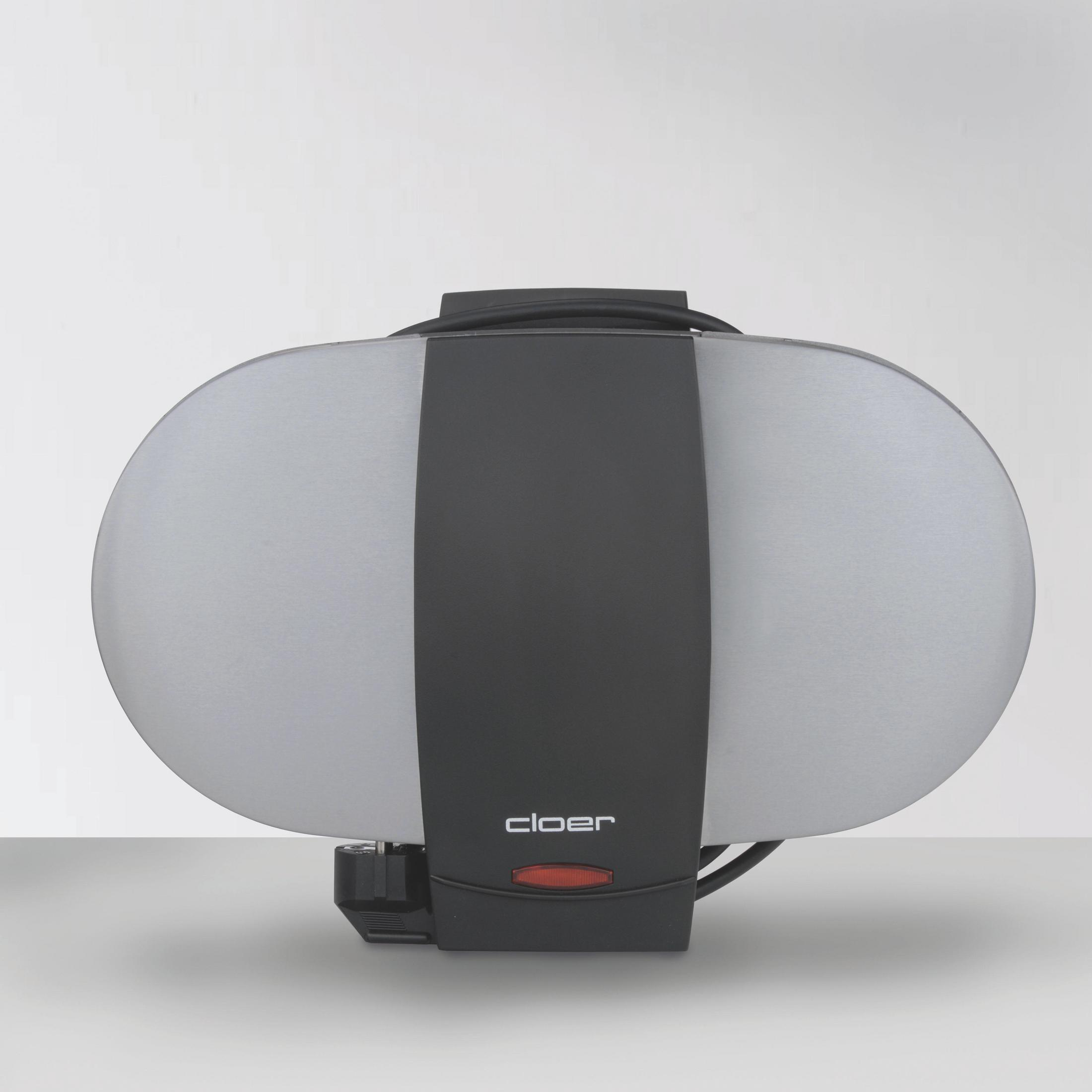 Owalna gofrownica Cloer, srebrno-czarna. Czerwone światło wskazuje działanie.