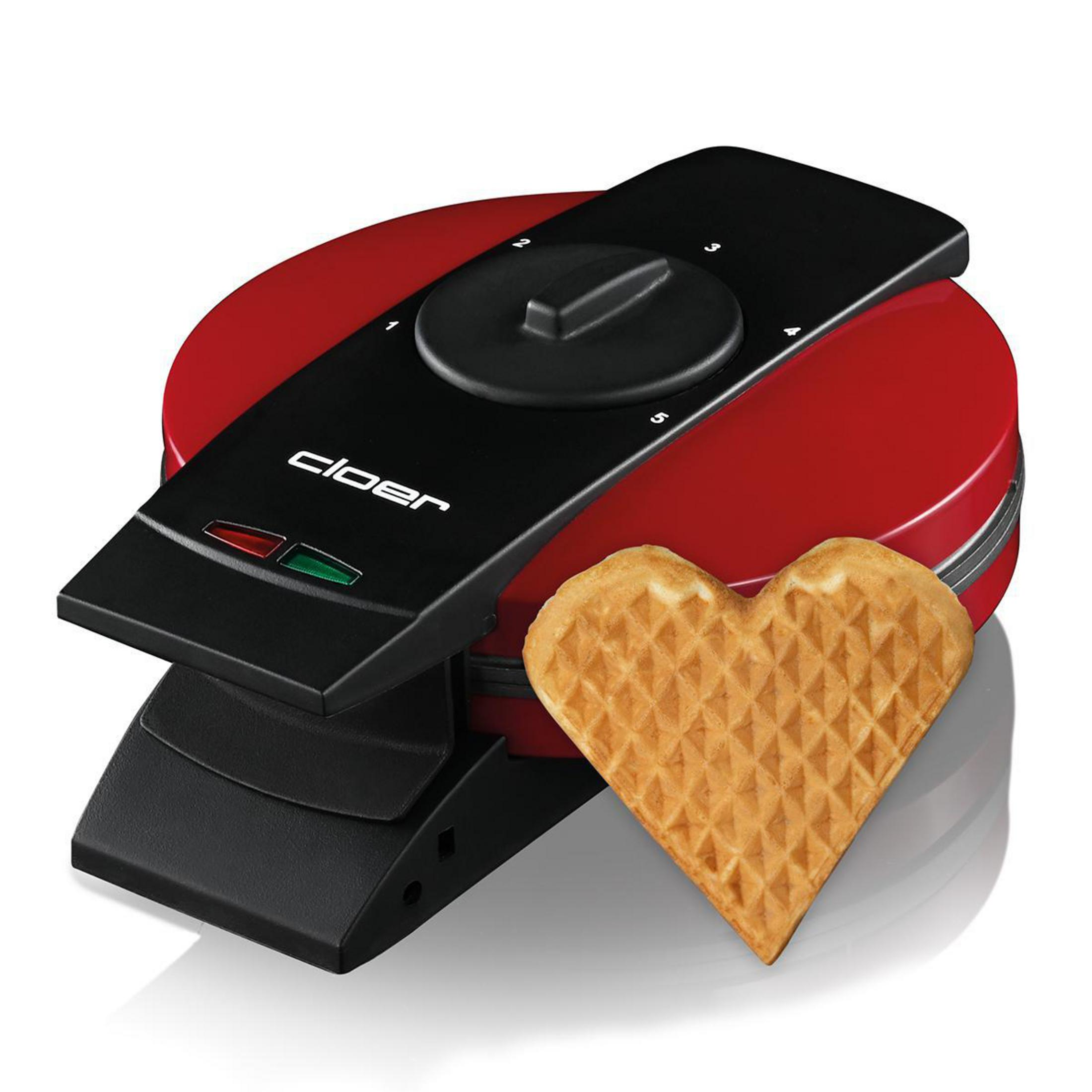 Czerwone gofrownica z gofrem w kształcie serca i czarnym panelem sterowania.