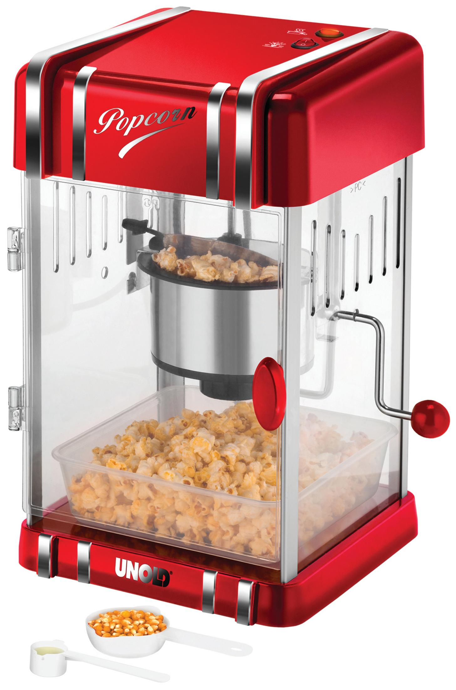 Eine rote Popcornmaschine. Popcorn und Maiskörner sind sichtbar.