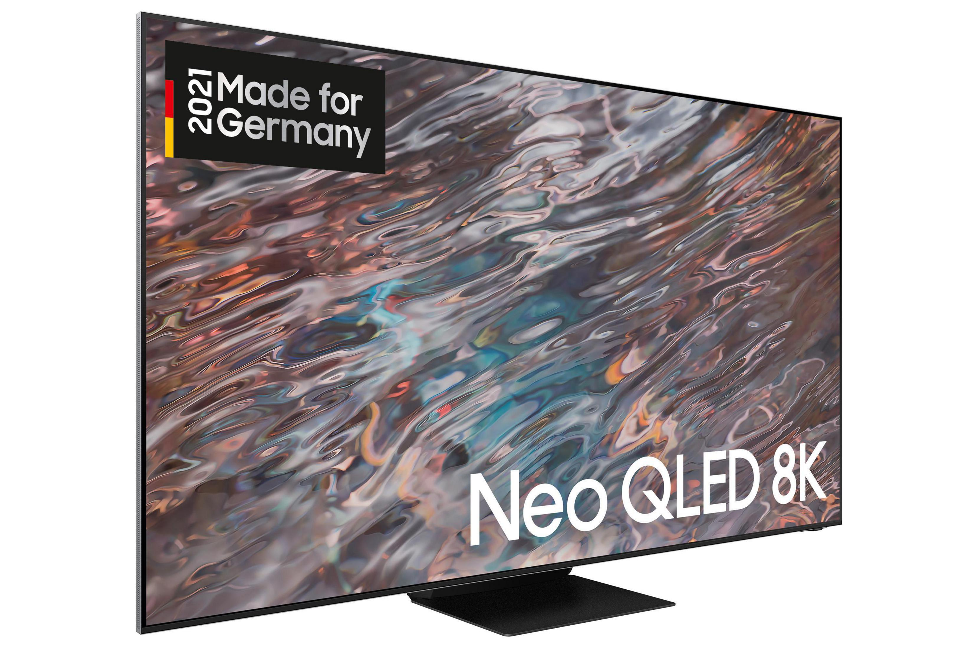 Czarny telewizor z zakrzywionym ekranem, pokazujący rozmyty obraz.