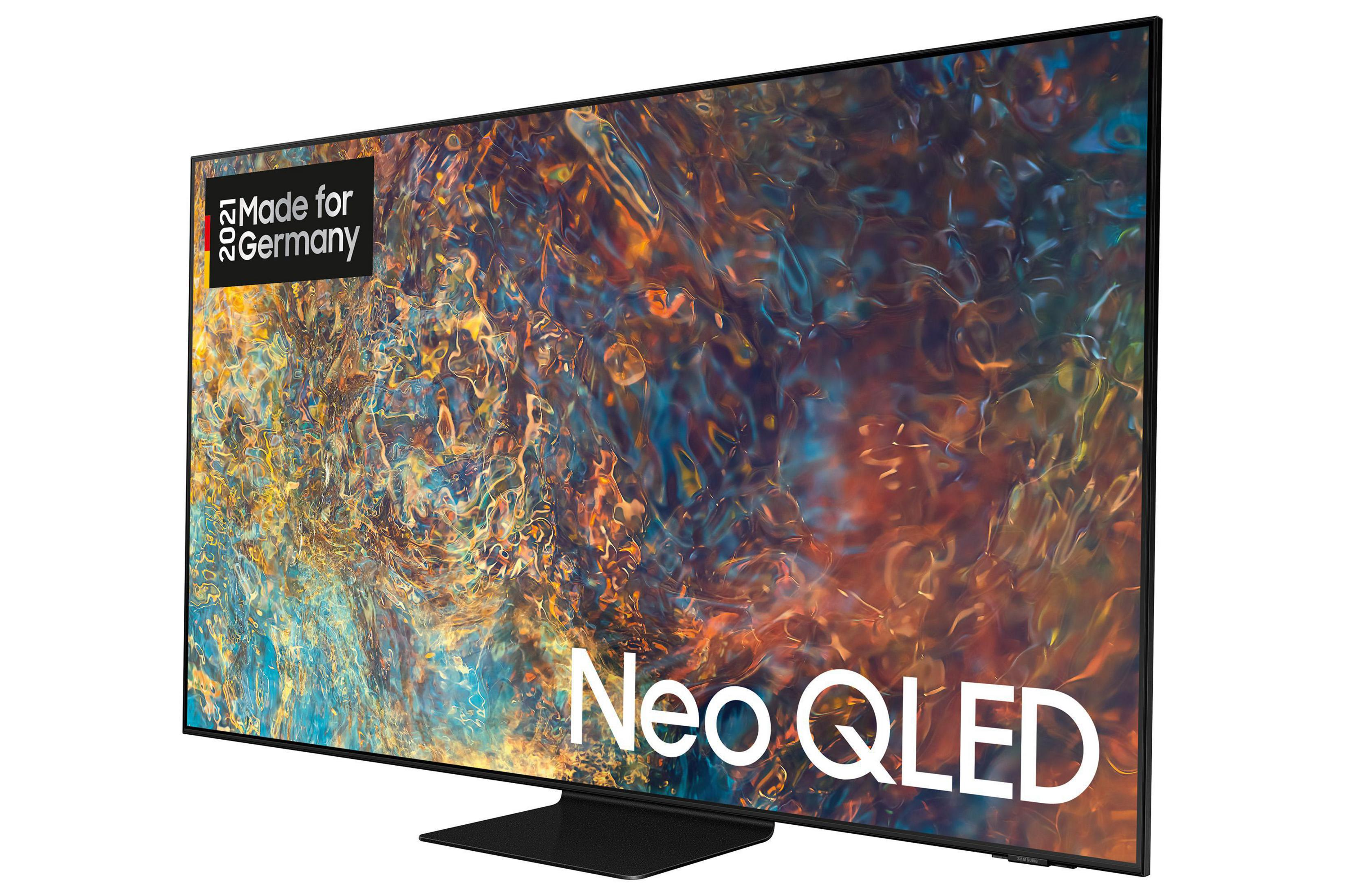 Neo QLED Fernseher mit schwarzem Rahmen und abstraktem Muster.