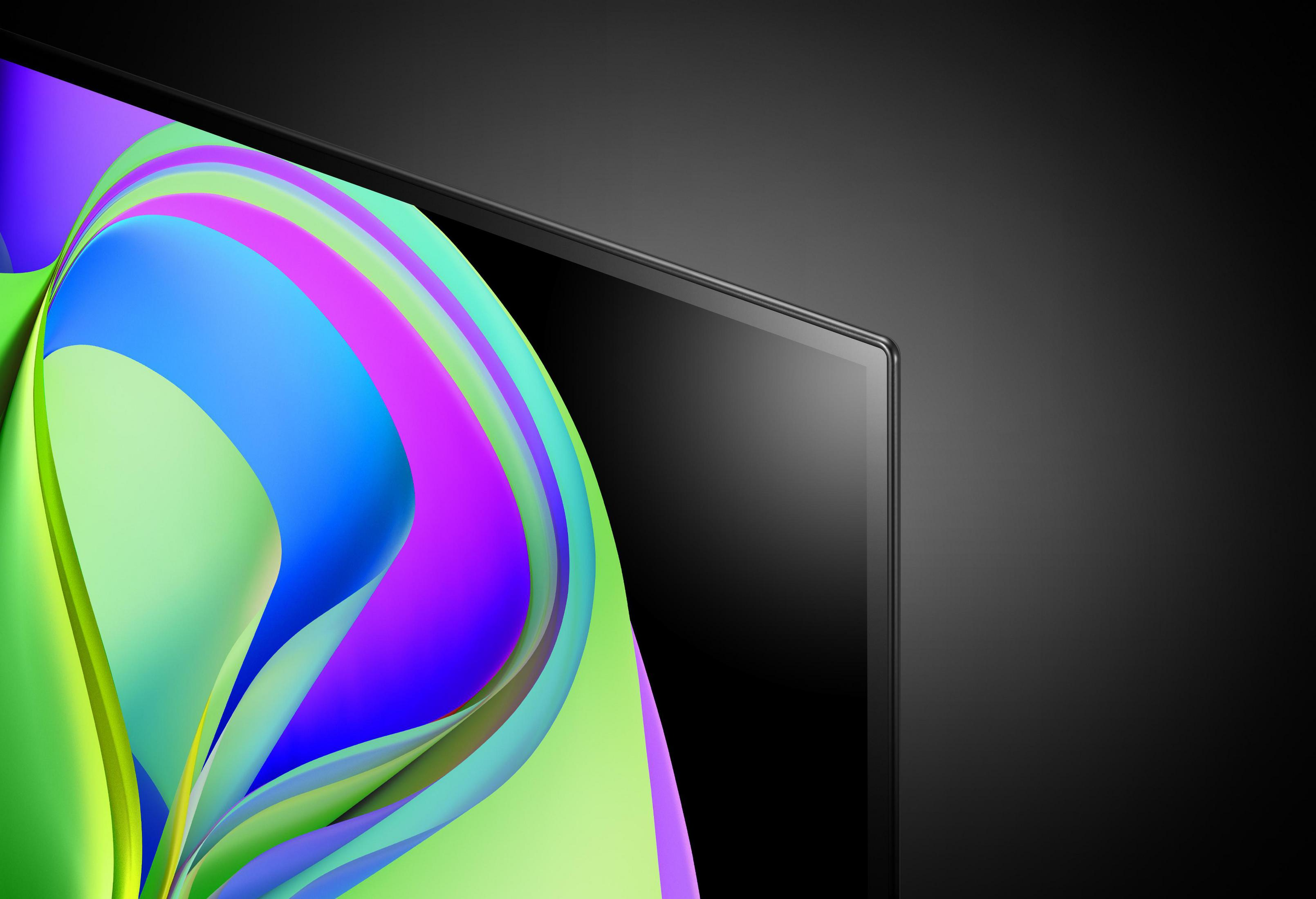 Zbliżenie na krawędź ekranu telewizora. Czarna ramka z kolorowymi, abstrakcyjnymi wzorami.