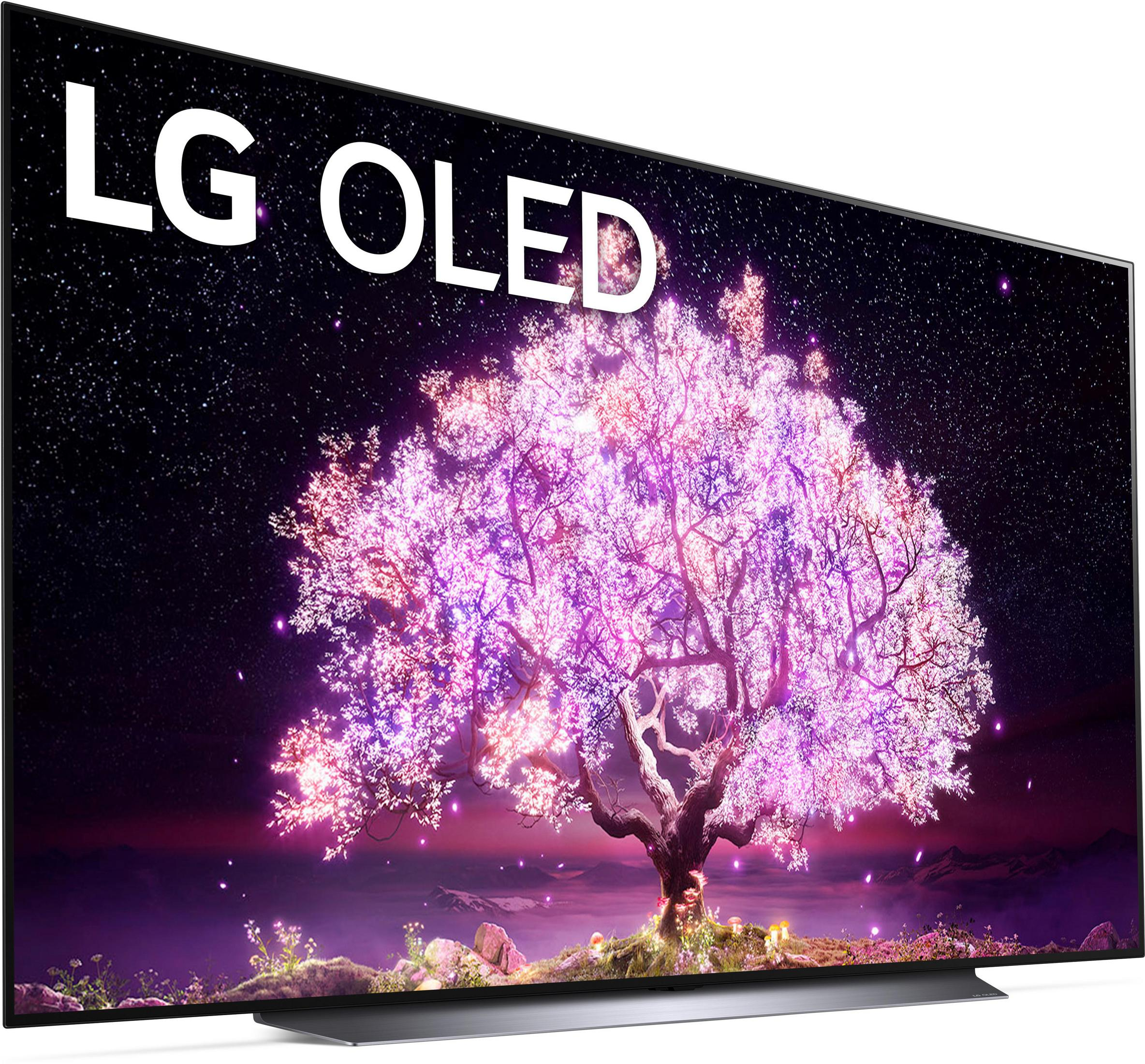 Der LG OLED TV zeigt einen Kirschblütenbaum bei Nacht. Der Fernseher ist angewinkelt und steht vor weißem Hintergrund.