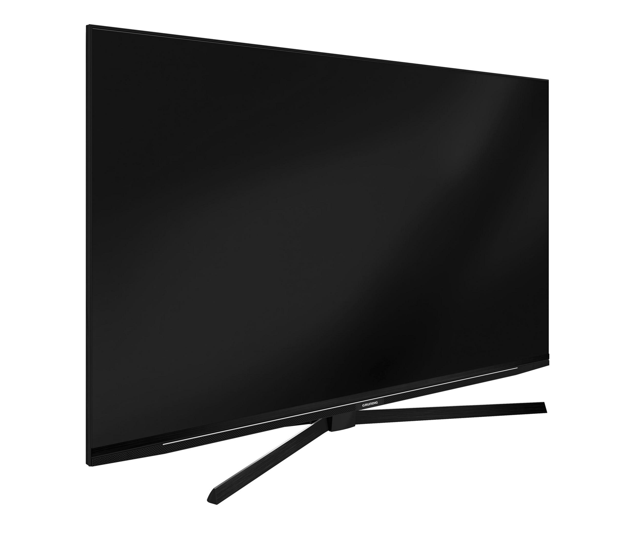 Une télévision à écran plat avec un pied, vue en angle. L'écran est noir.